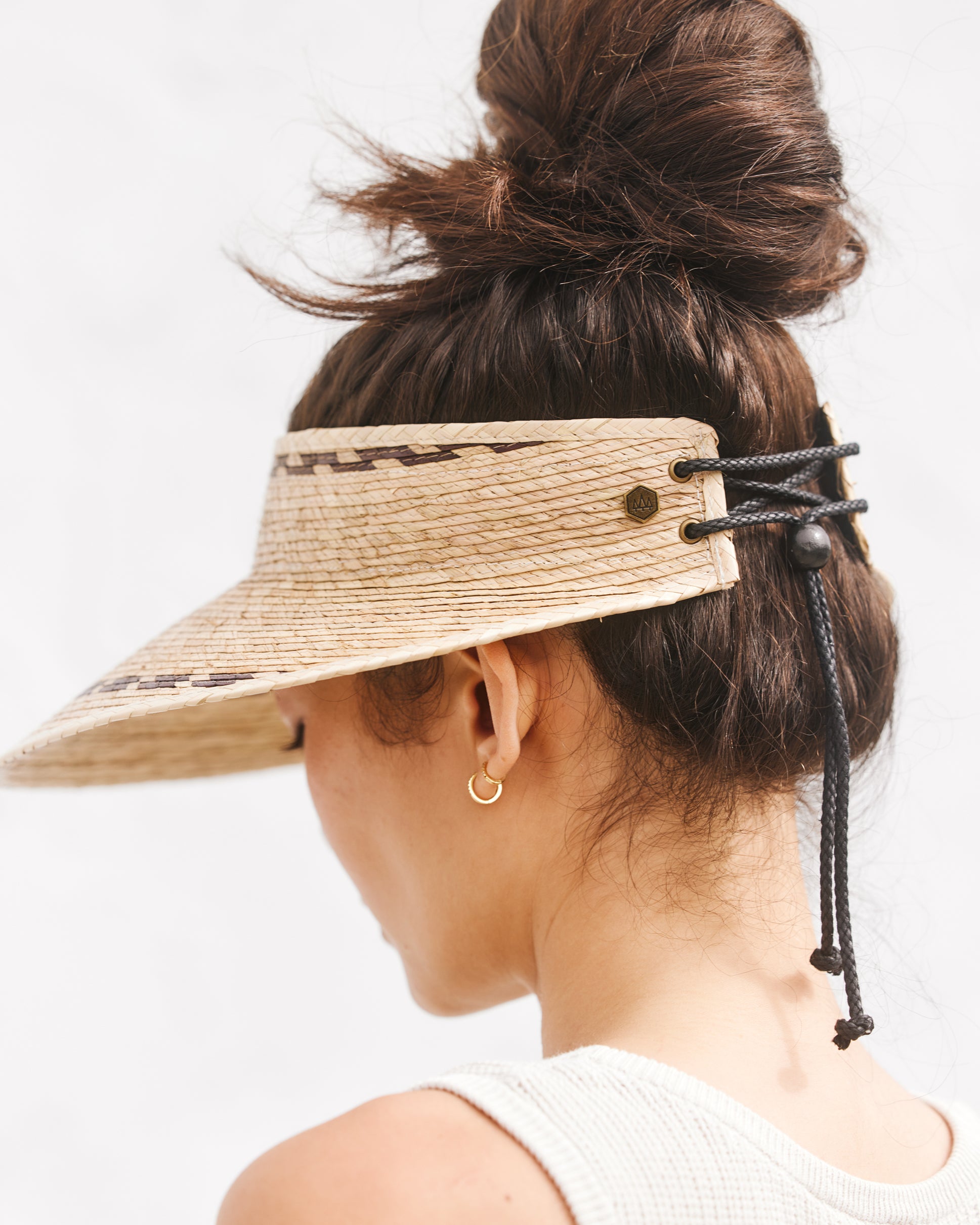 Hemlock female model wearing the Catalina Straw Visor