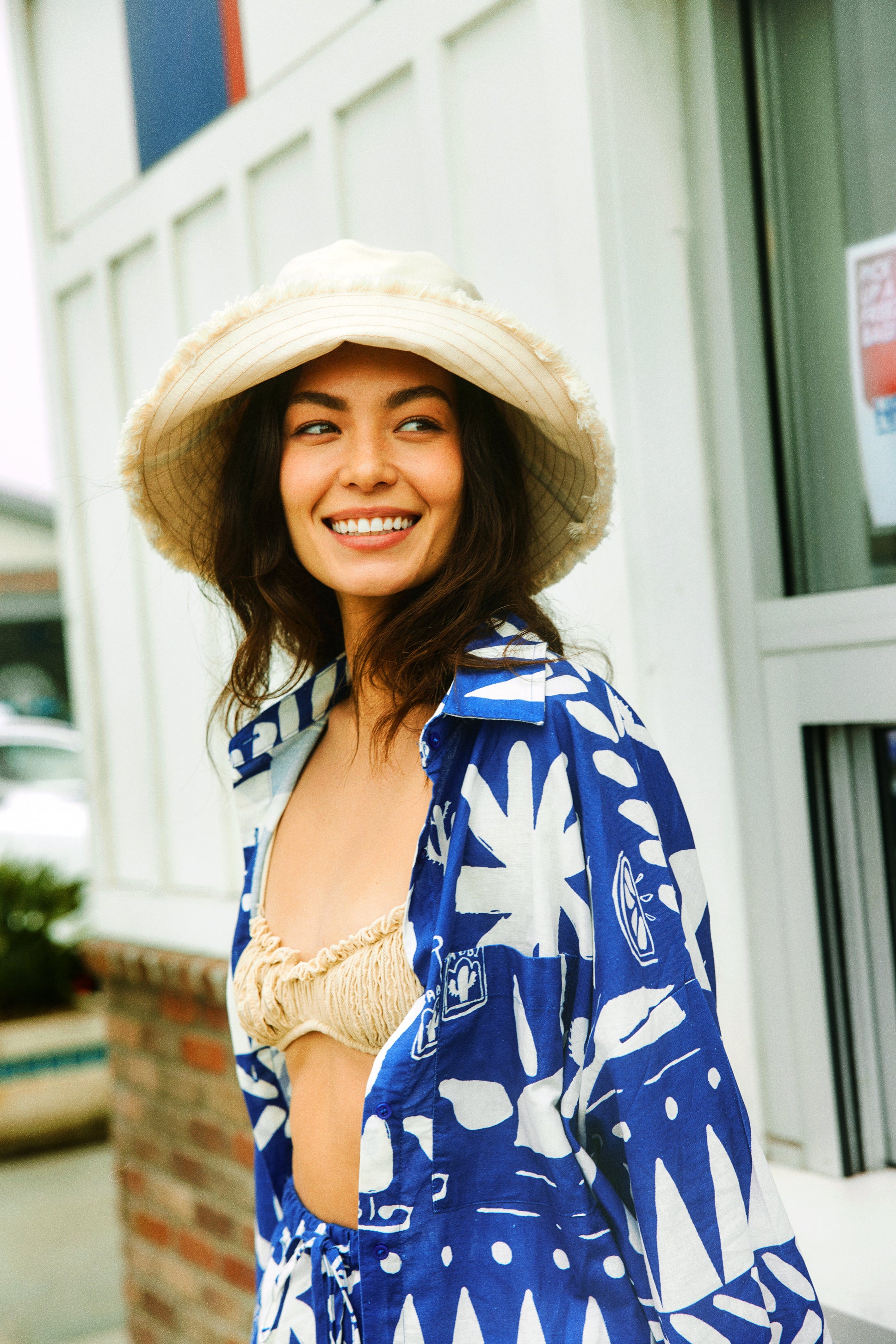 Hemlock female model wearing the Ibiza Wide Brim Bucket smiling