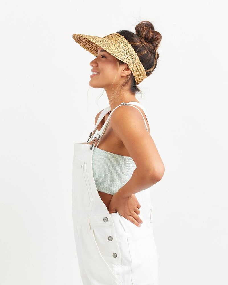 Hemlock female model side profile wearing Capri Straw visor in Honeycomb 