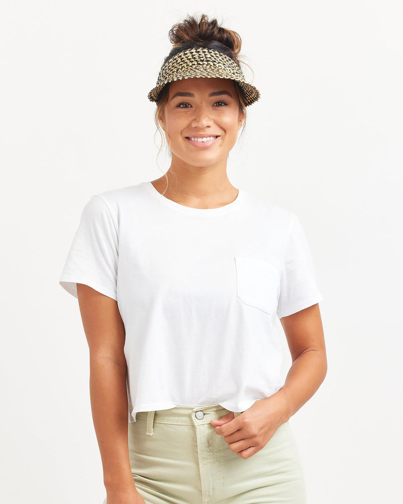 Hemlock female model looking straight wearing Capri Straw visor in Pepper