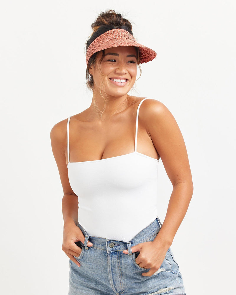 Hemlock female model looking right wearing Capri Straw visor in Rose