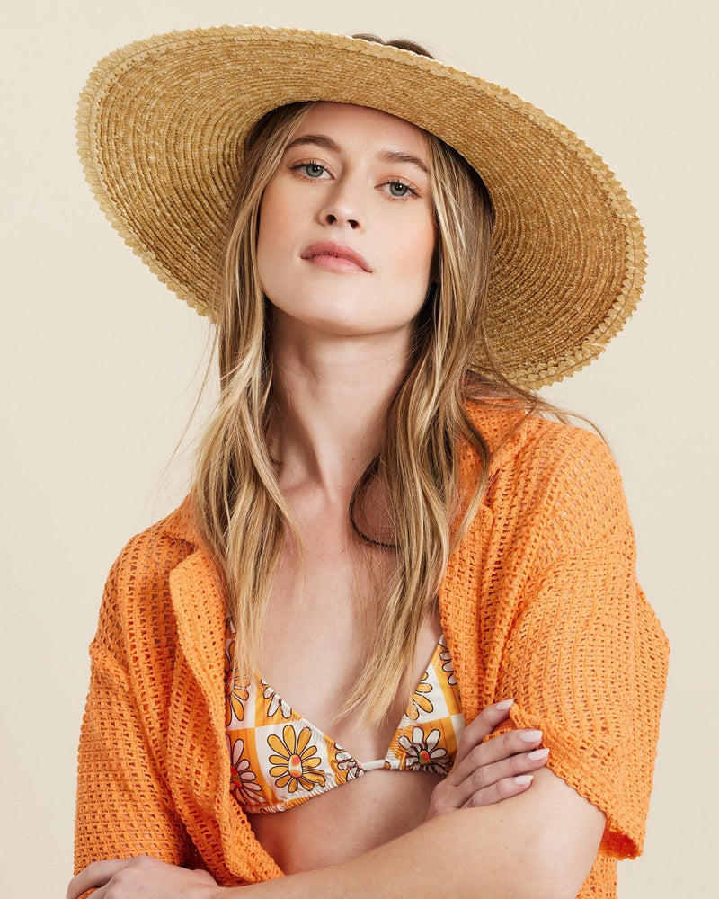 Hemlock female model looking straight wearing Tropez Straw Visor in Blonde