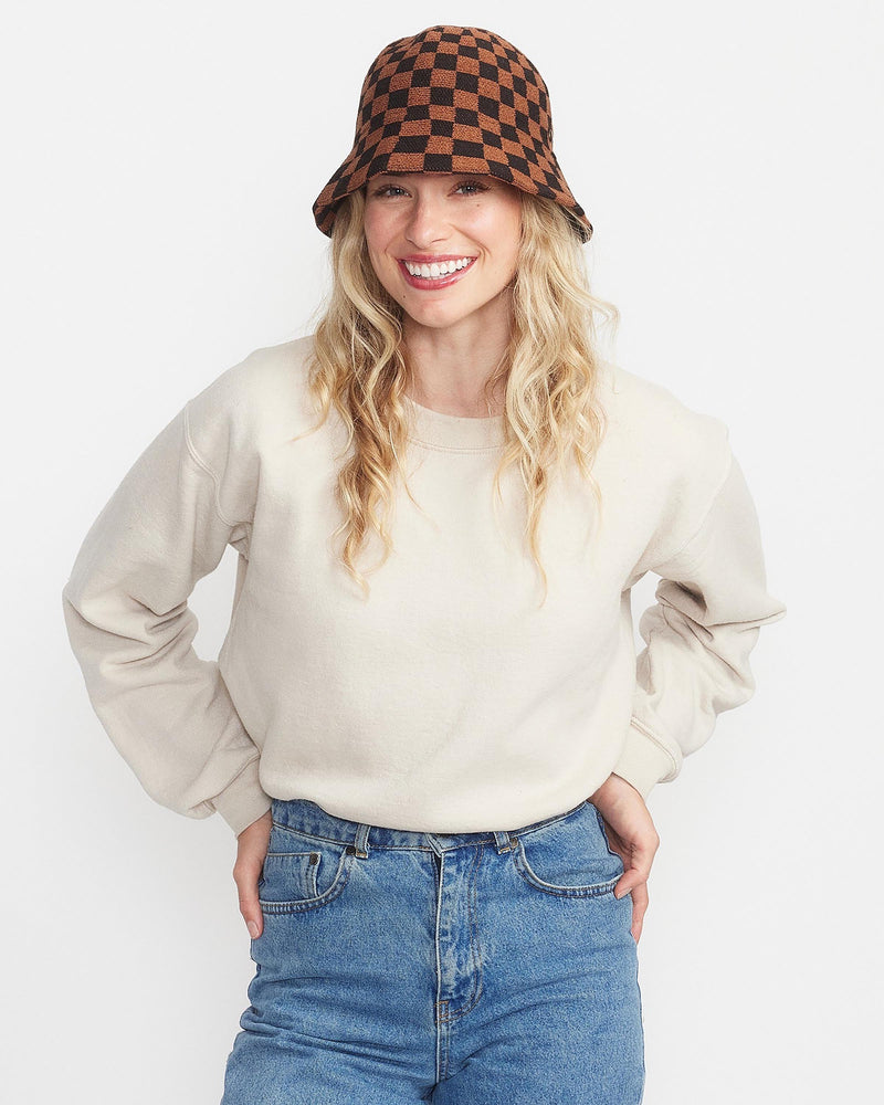 Hemlock female model looking straight wearing Kennedy Cotton Bucket Hat in Brown Check