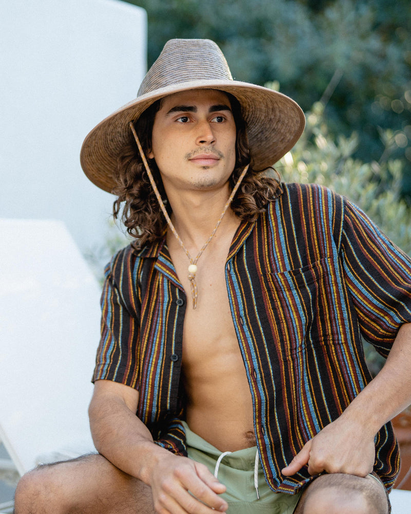 Hemlock male model looking right wearing Santos Straw Lifeguard Hat in Toast