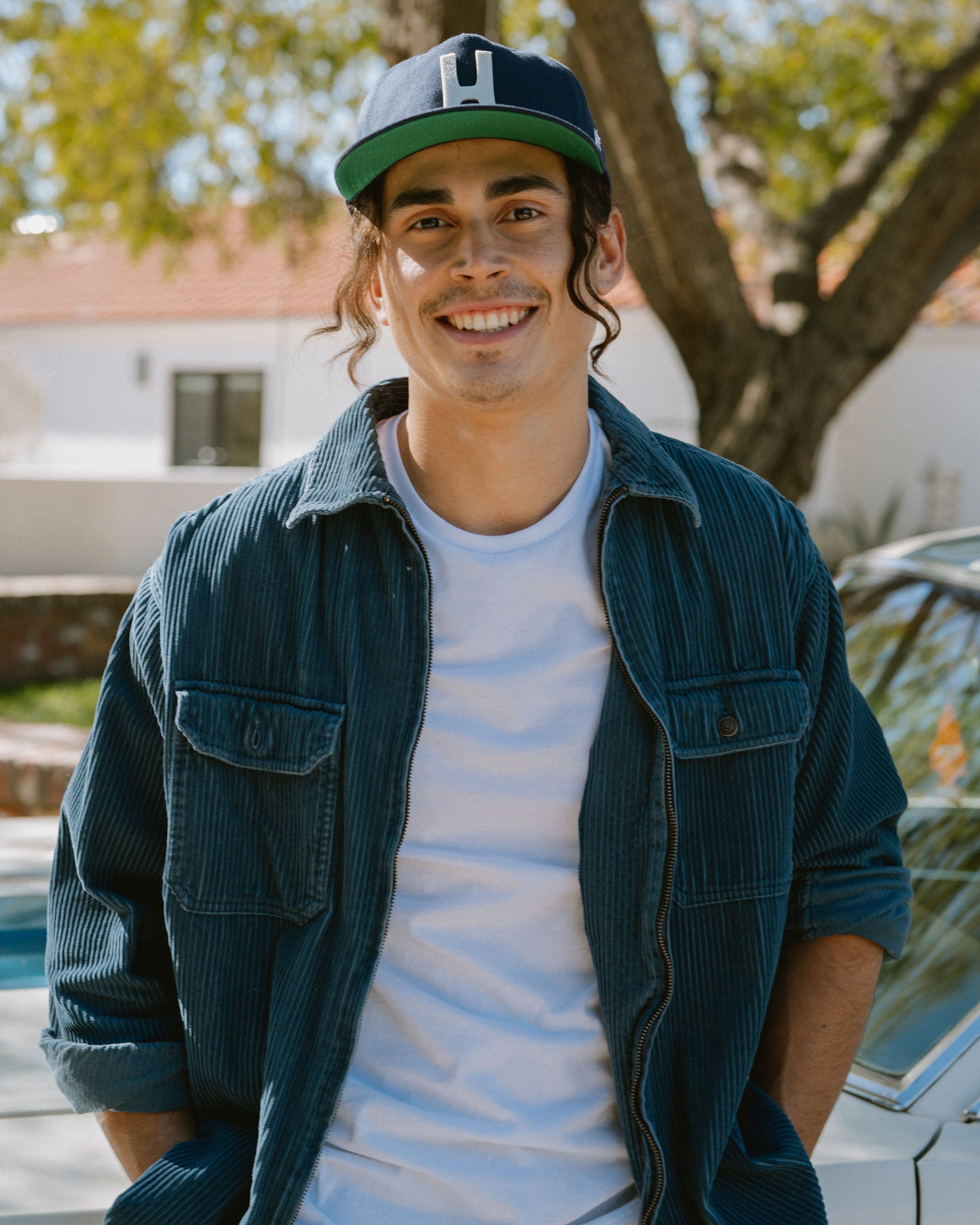Hemlock male model looking straight wearing Thomas Baseball Hat in Navy