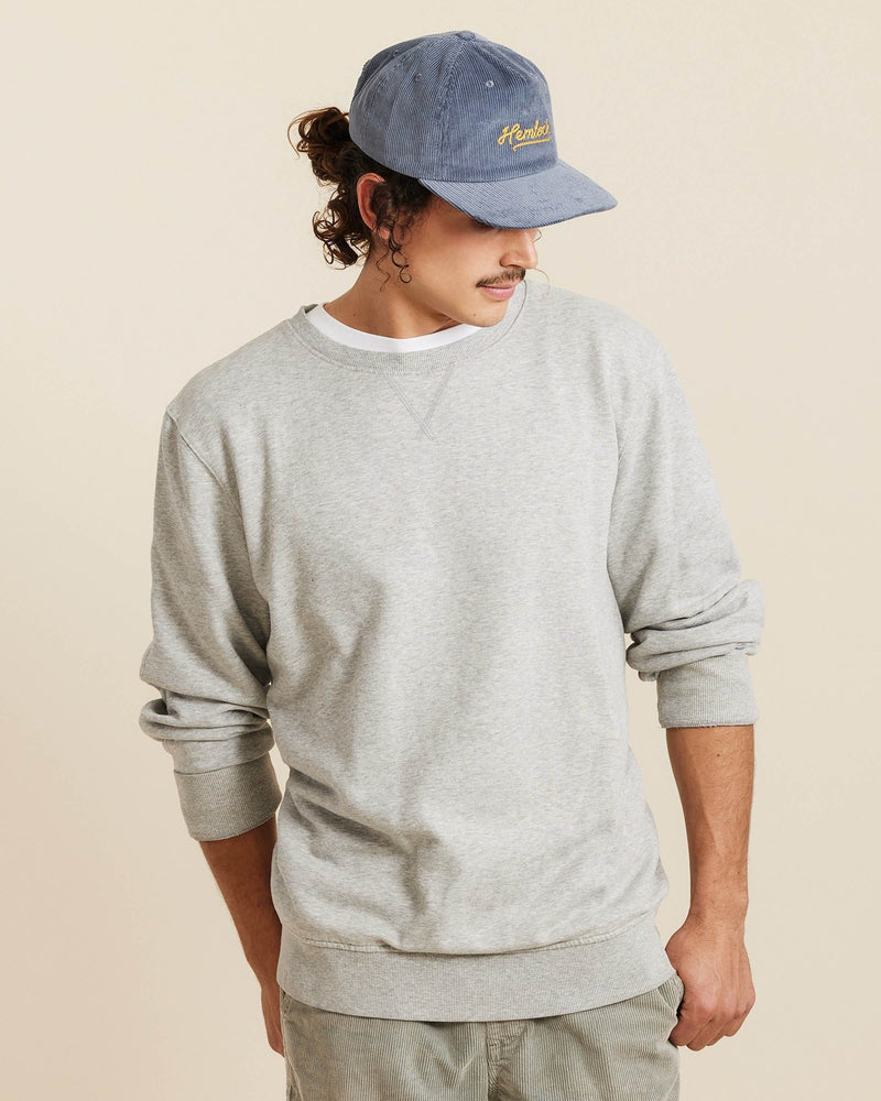 Hemlock male model looking down wearing Hemlock Wesley Corduroy Baseball Hat in Dusty Blue