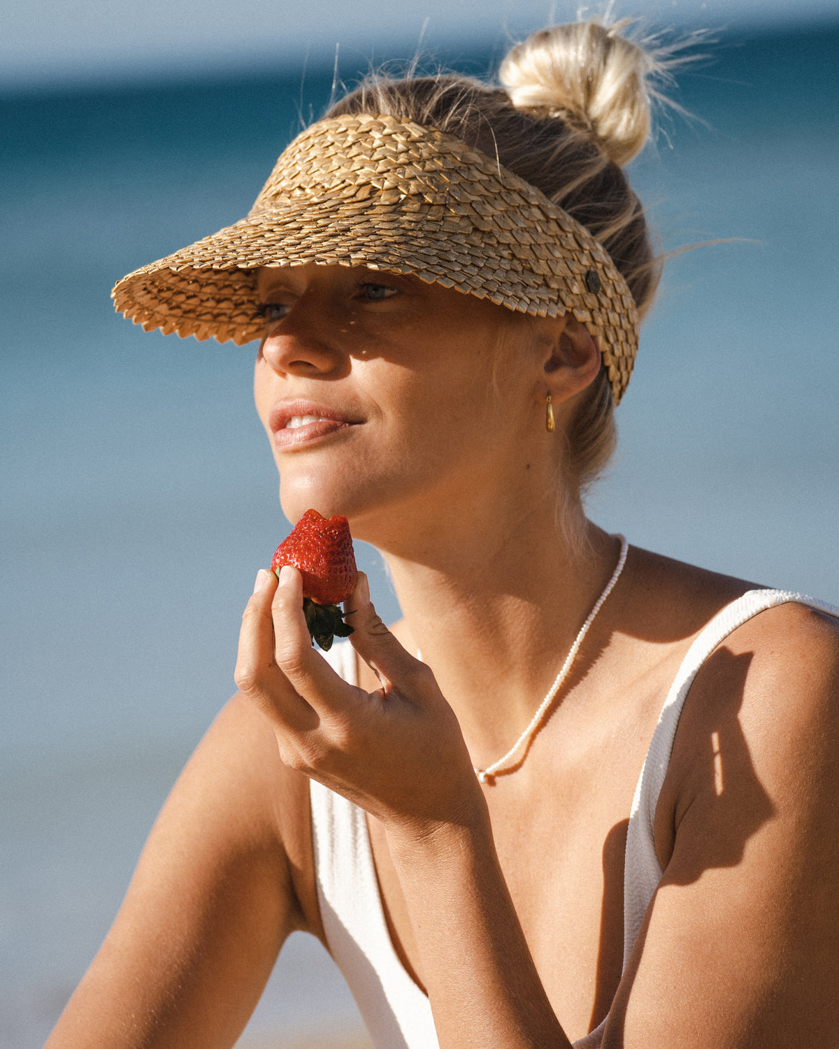 Capri Straw Visor in honeycomb viewed from the front on a neutral background.