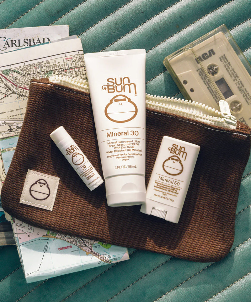 Sun Bum® Mineral Kit laying on road trip essentials
