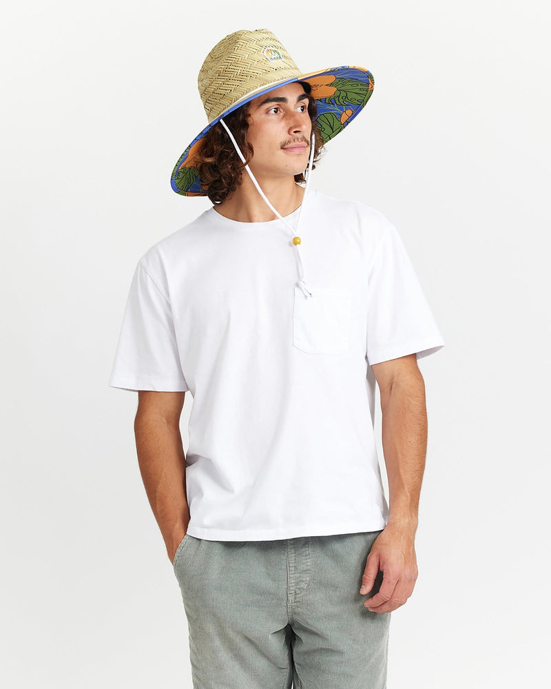 Hemlock male model looking right wearing Andy Straw Lifeguard Hat with Poppy Floral pattern
