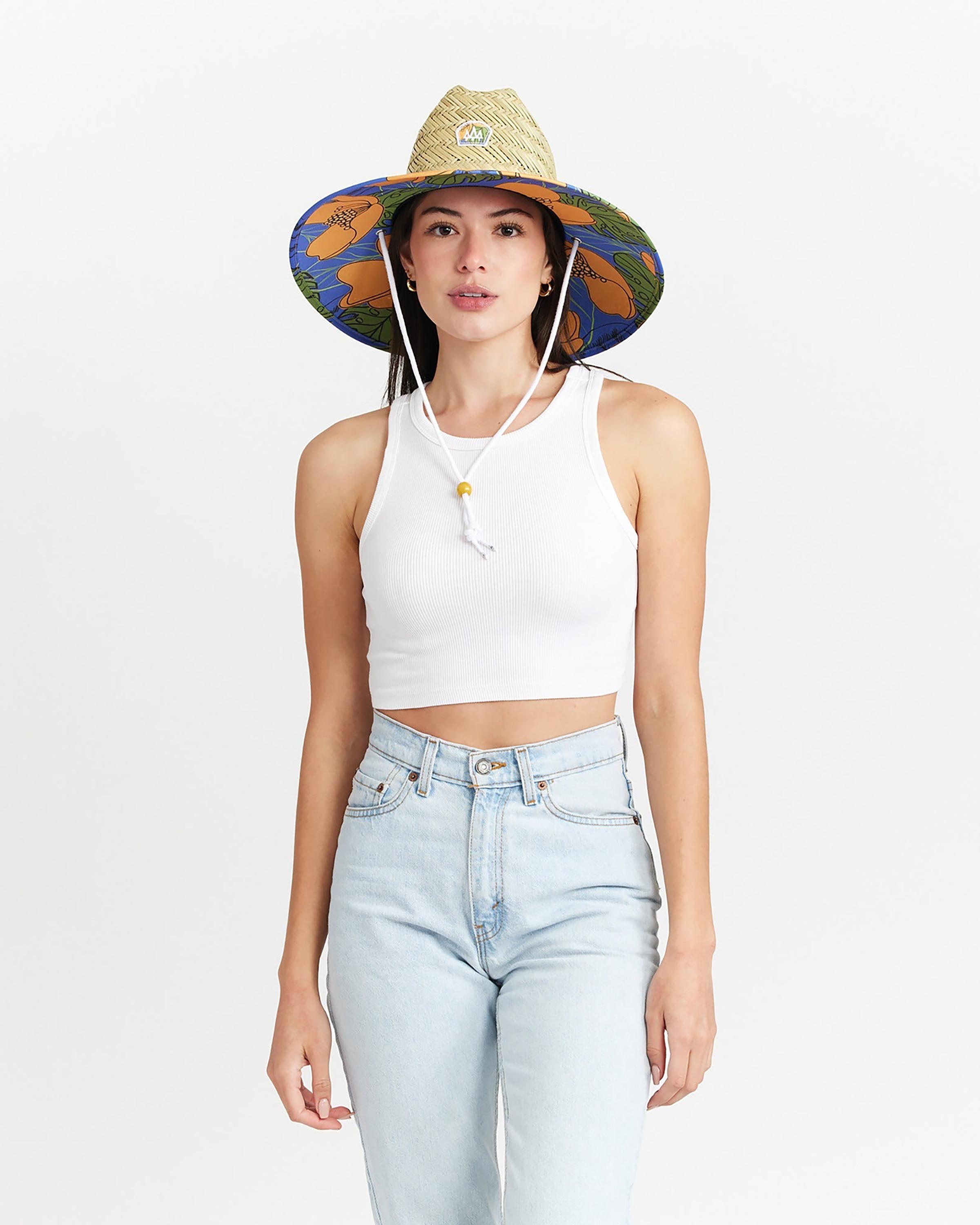 Hemlock female model looking straight wearing Andy Straw Lifeguard Hat with Poppy Floral pattern