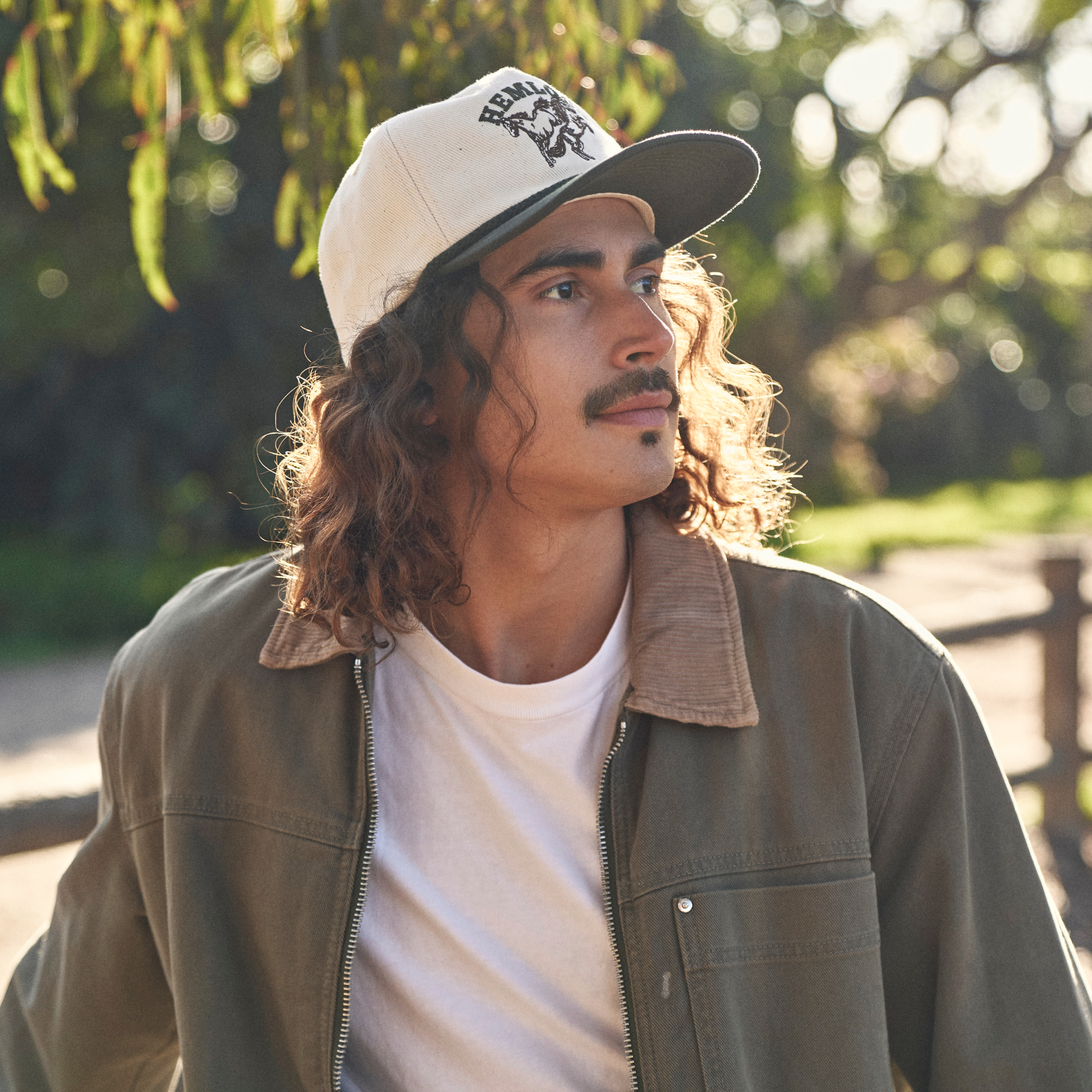 hemlock male model wearing the bucking baseball hat - ball caps collection card