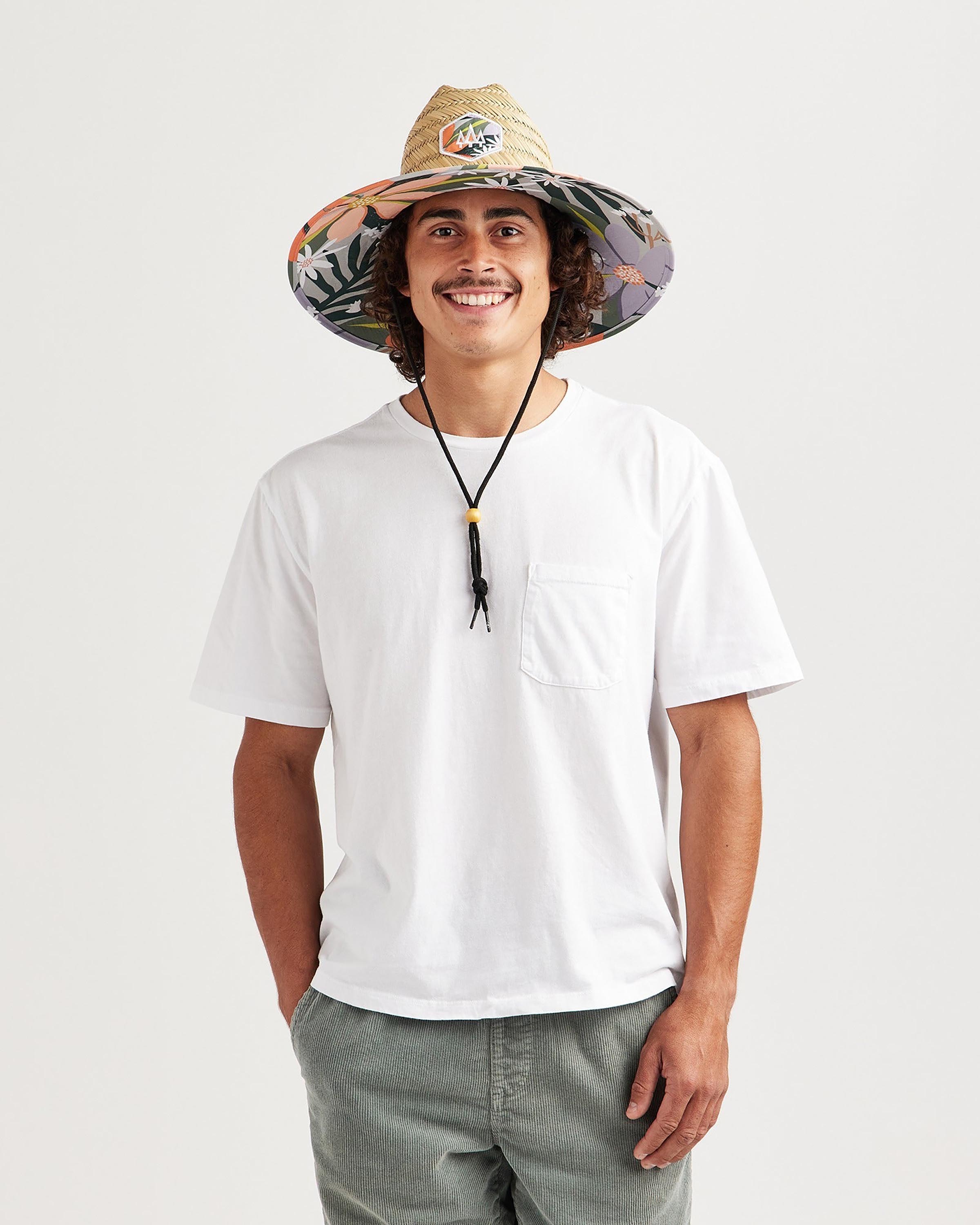 Hemlock male model looking straight wearing Barbados straw lifeguard hat with orange floral print