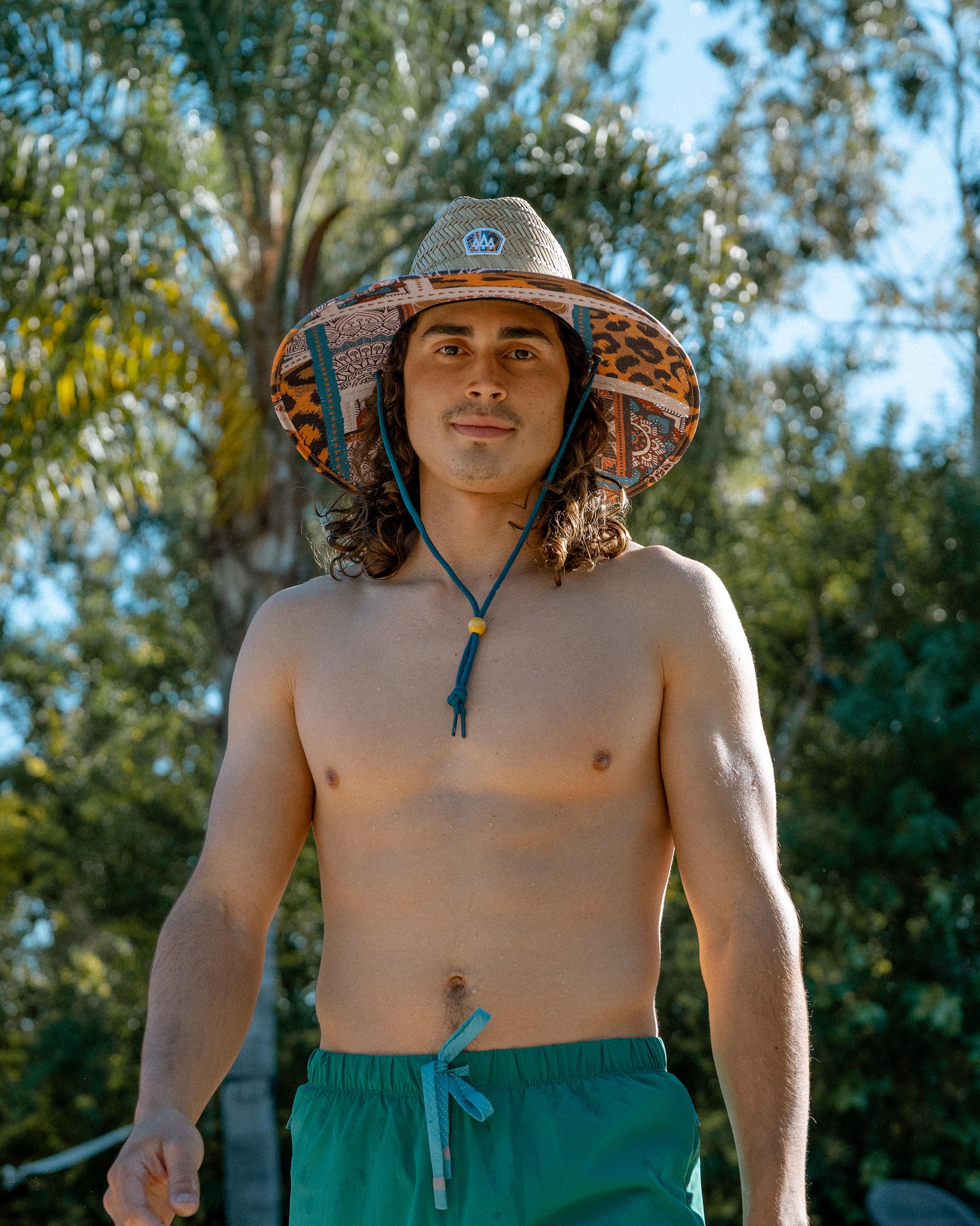 Hemlock male model looking straight wearing Bazaar straw lifeguard hat with cheetah mosaic
