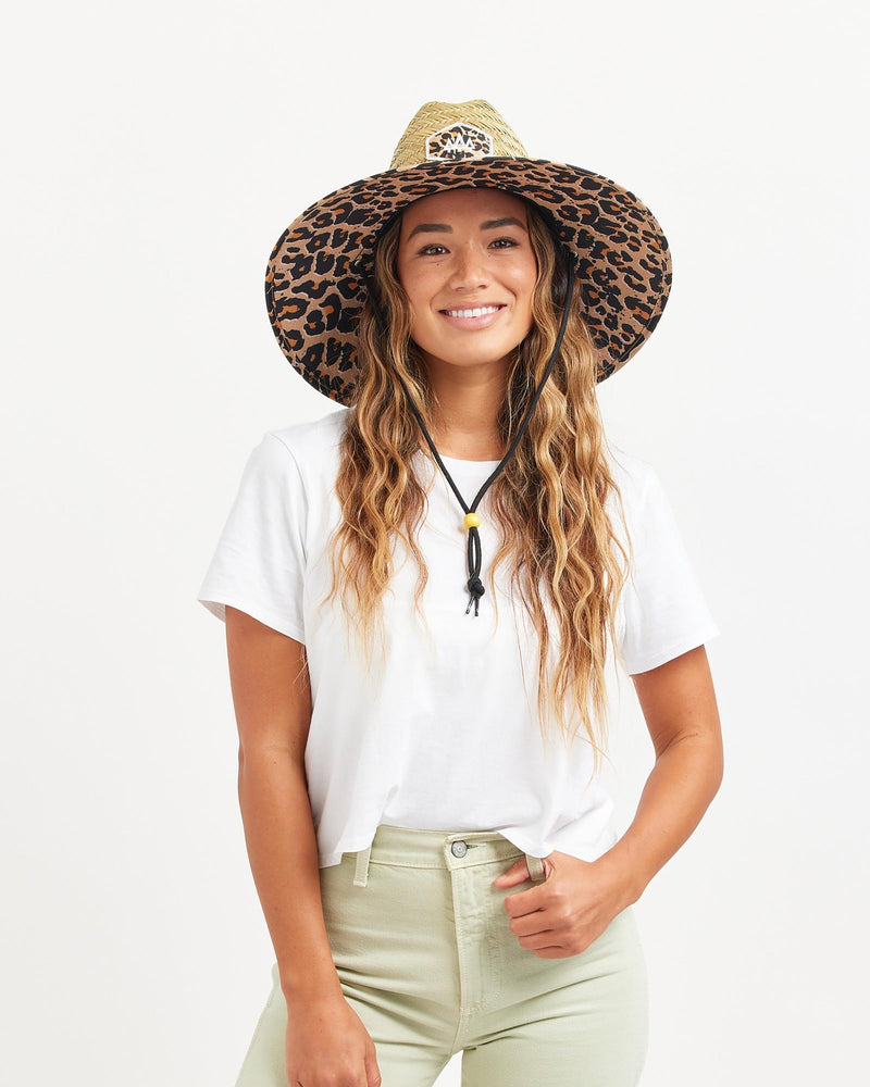 Hemlock female model looking straight wearing Big Cat straw lifeguard hat with Classic Leopard pattern