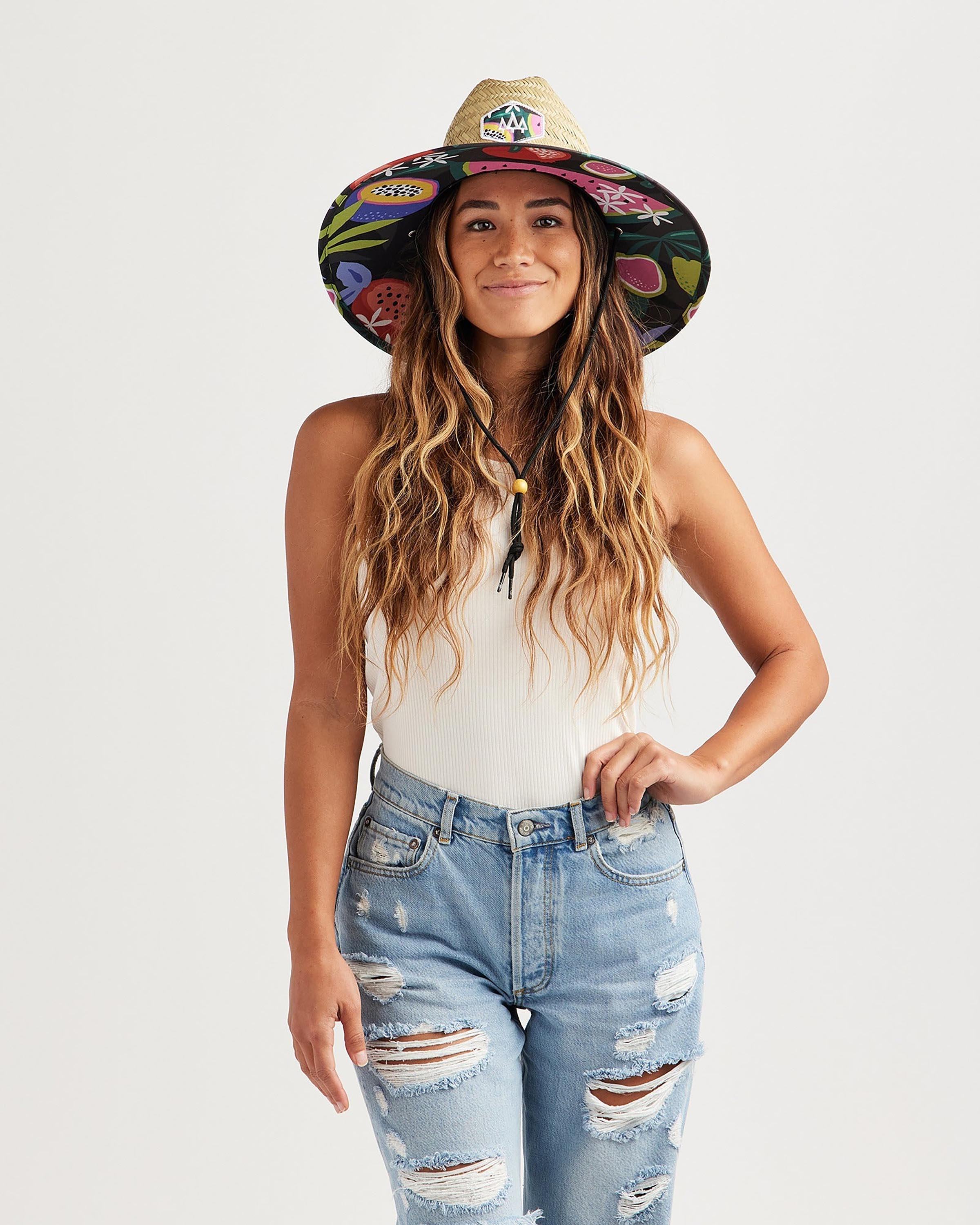 Hemlock female model looking straight wearing Blend straw lifeguard hat with Fruit pattern