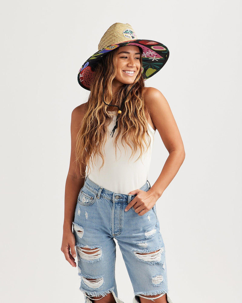 Hemlock female model looking right wearing Blend straw lifeguard hat with Fruit pattern