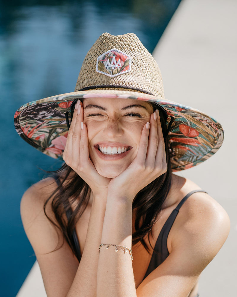 Hemlock female model looking straight wearing Bombay straw lifeguard hat with Panther pattern