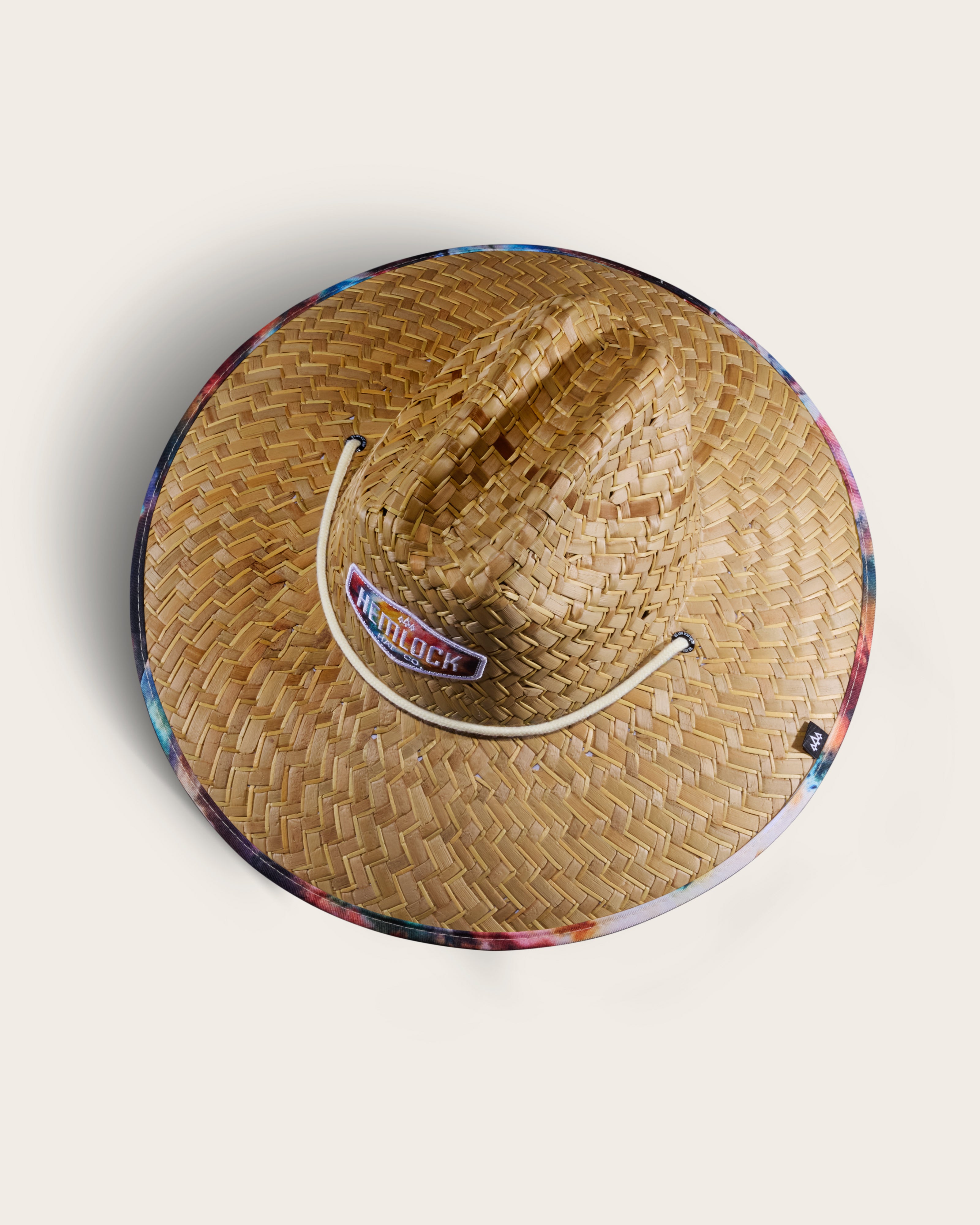 Hemlock Bowie straw lifeguard hat with Tie Dye pattern top of hat