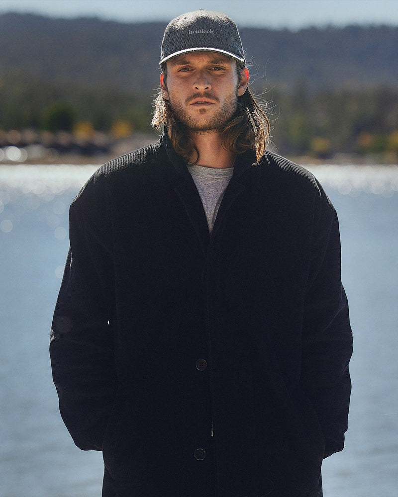 Hemlock male model looking straight wearing Bristol Dad Hat in Grey and Black