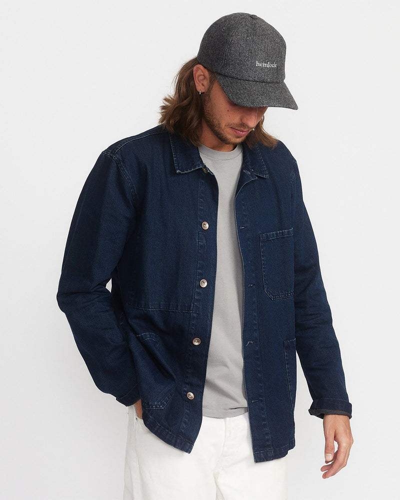 Hemlock male model looking down wearing Bristol Dad Hat in Grey and Black