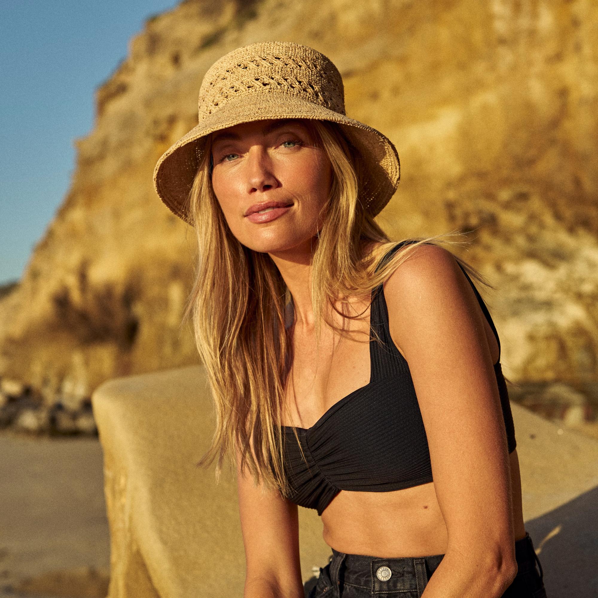 hemlock female model wearing the olivia straw bucket - bucket collection card
