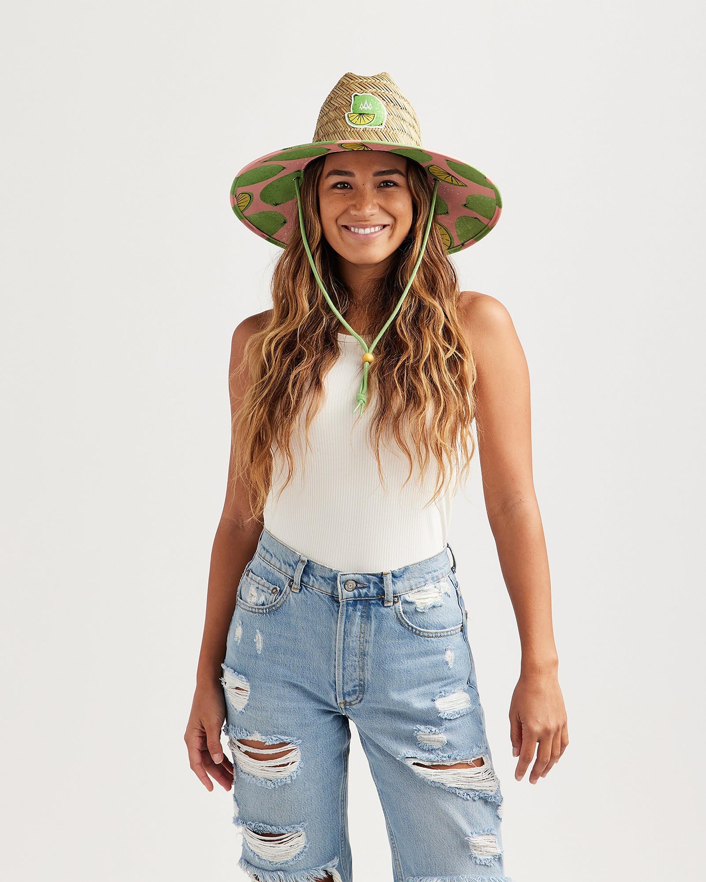 Hemlock female model looking straight wearing Cadillac straw lifeguard hat with lime pattern