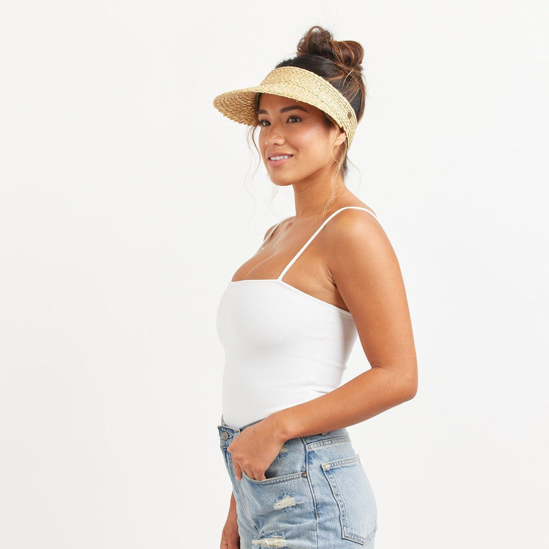 Hemlock female model looking left wearing  Capri Straw visor in Blonde