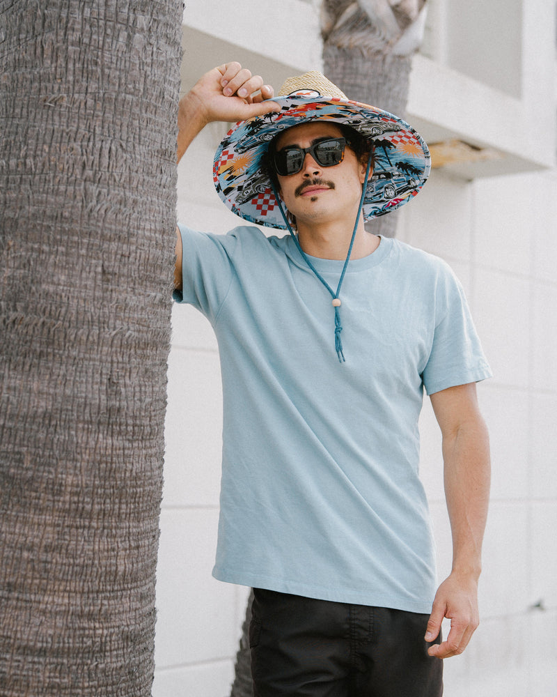 Hemlock male Model wearing the
UPF50+ Lifeguard hat in Racing Legend
print