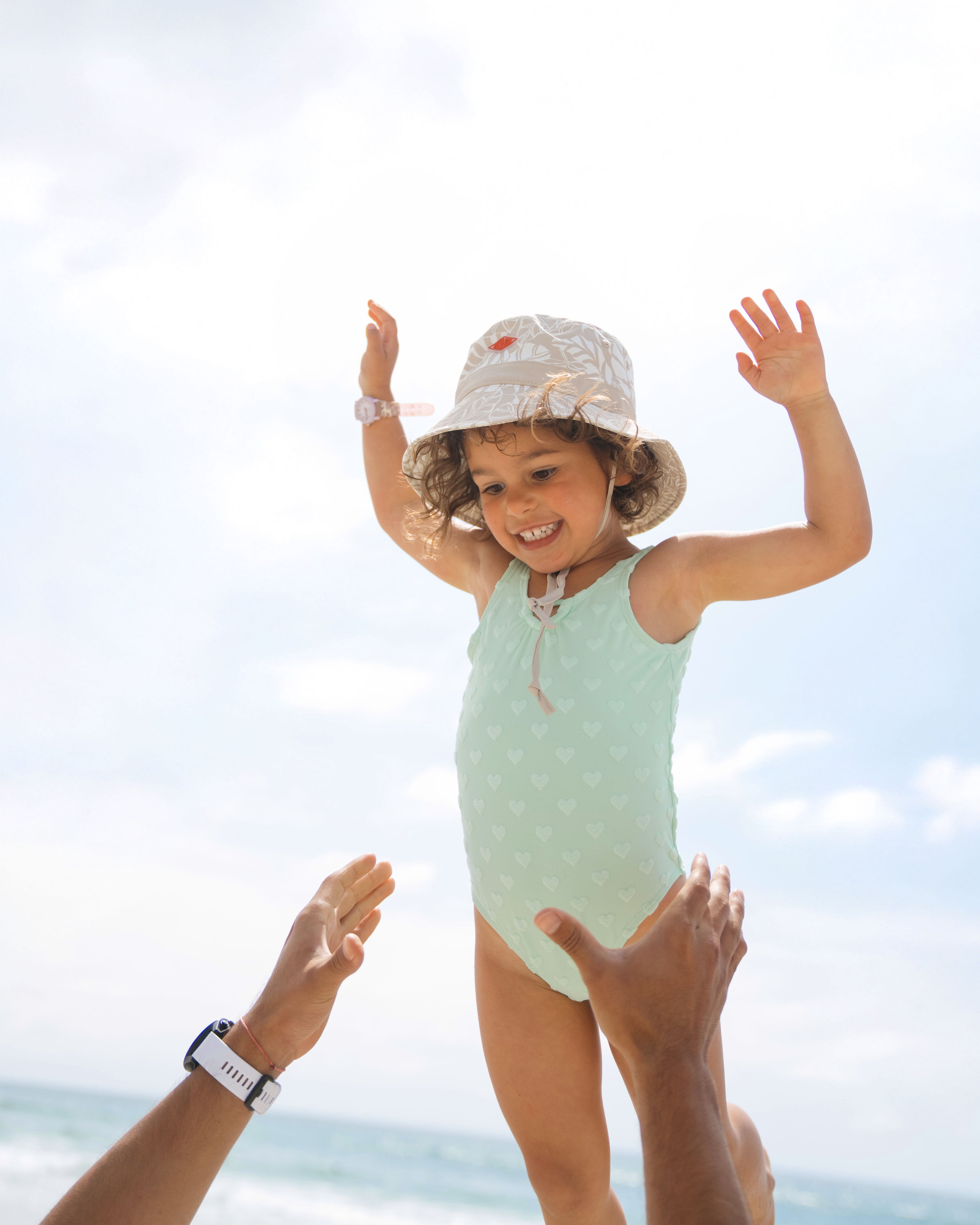 Toddler girl hemlock model wearing the surfari bucket hat