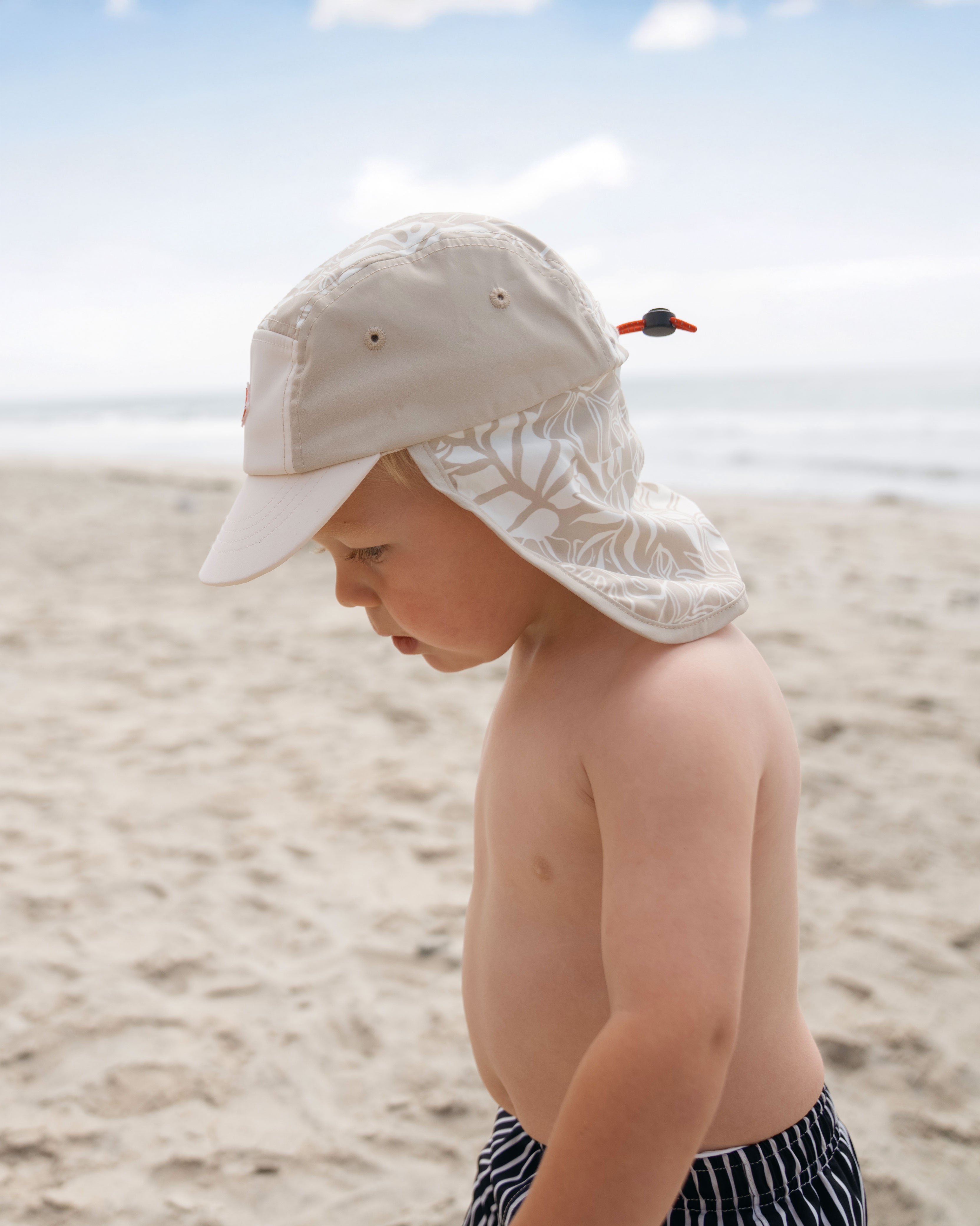 baby boy hemlock model wearing the surfari cap side view