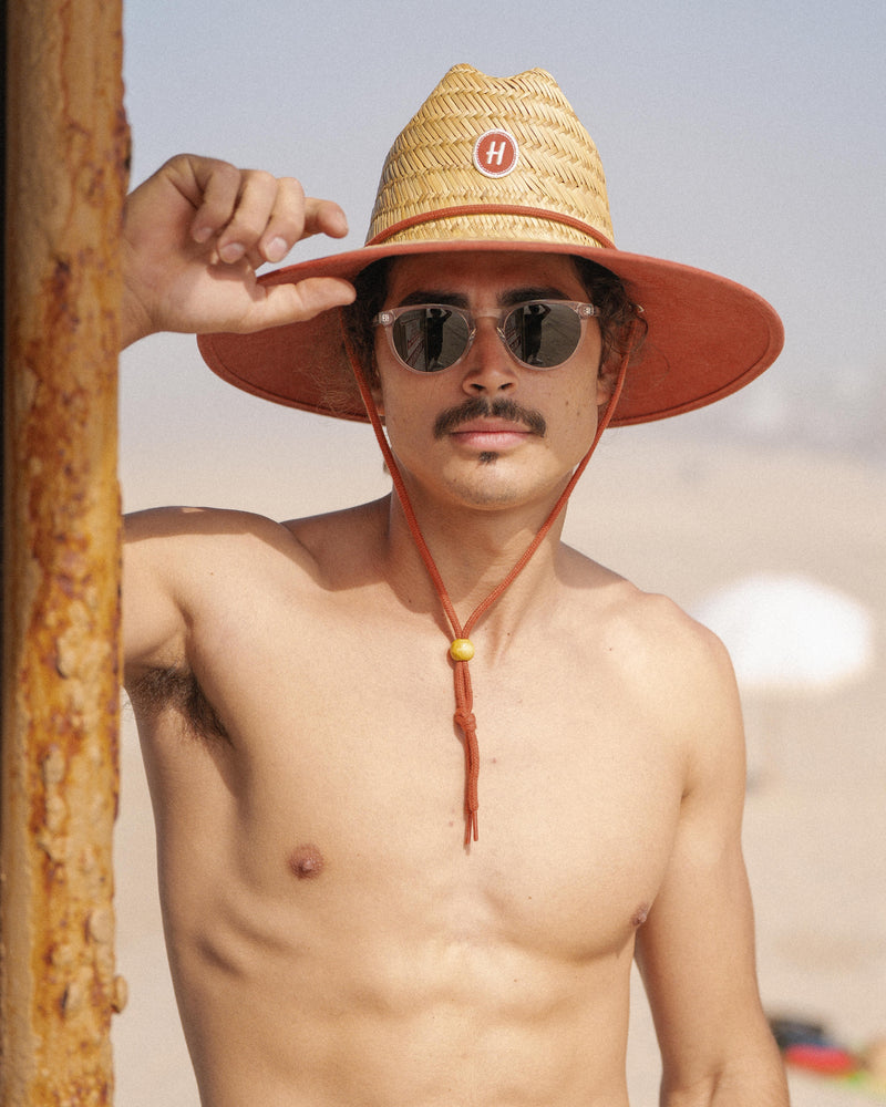 Hemlock male Model wearing the
UPF50+ Lifeguard hat in Sedona Clay
print