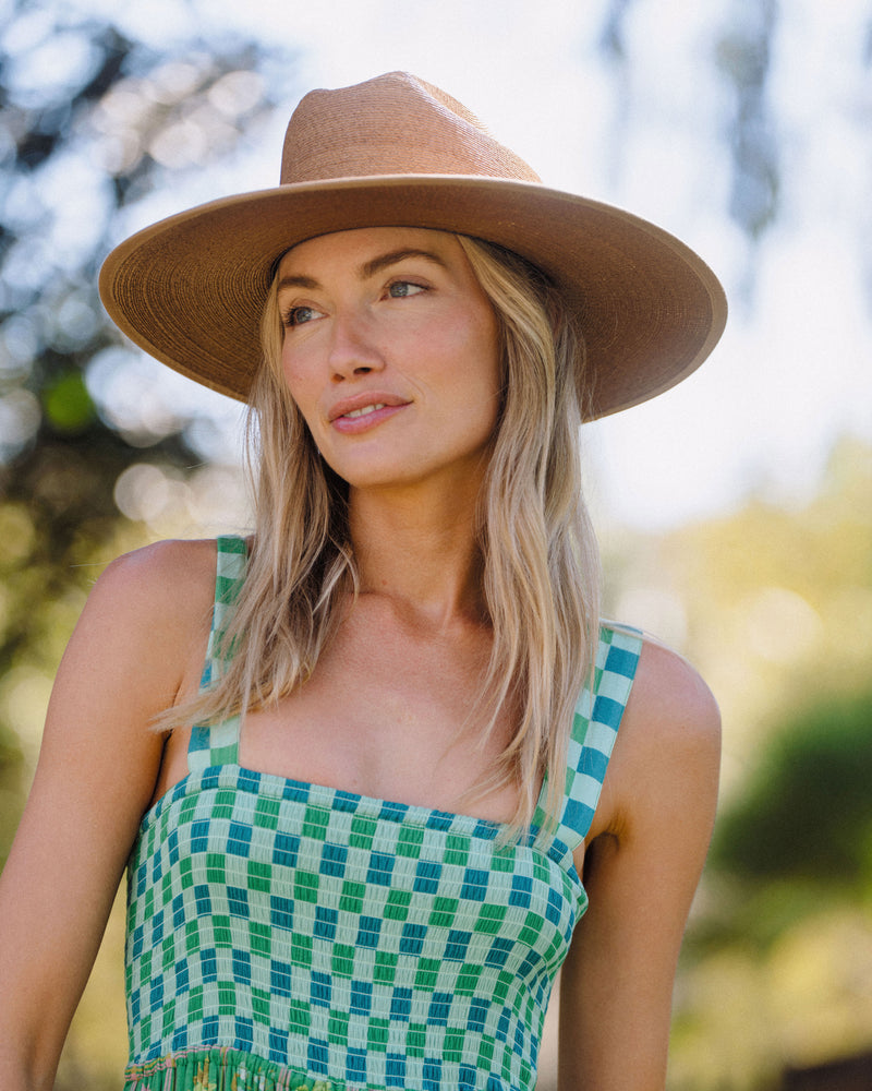 Hemlock female model wearing the Toluca Rancher Straw Hat in Saddle 