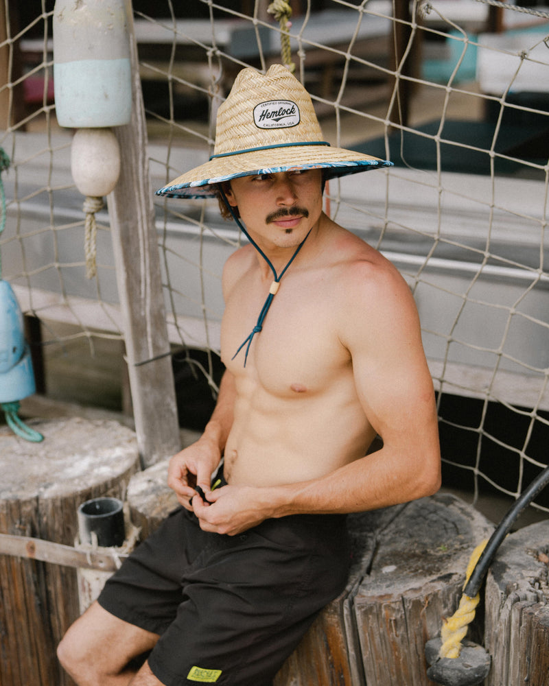 Hemlock male Model wearing the
UPF50+ Lifeguard hat in Blue Fish
print