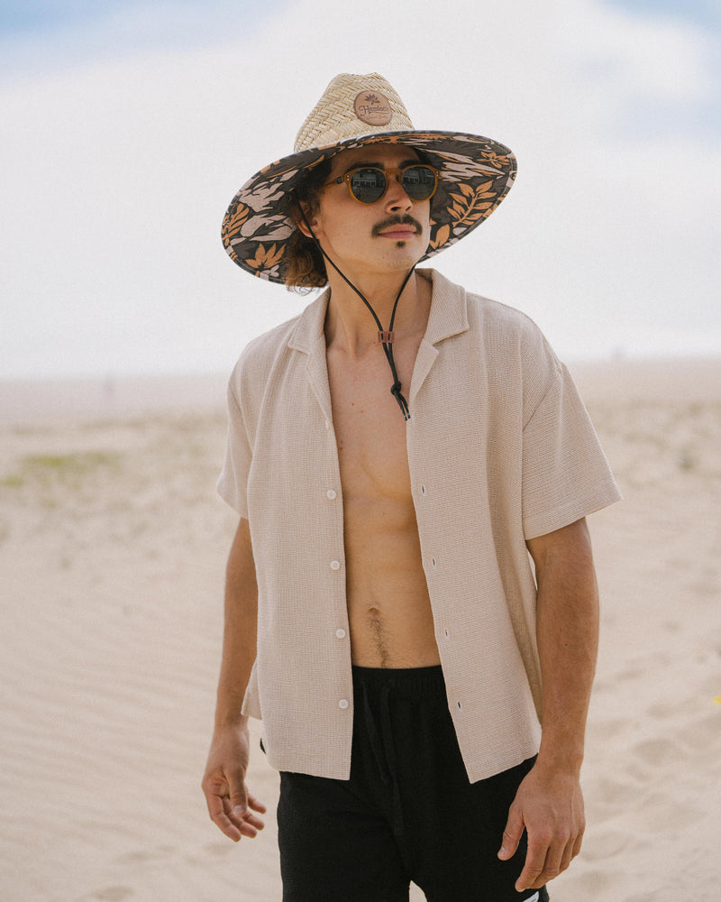 Hemlock male Model wearing the
UPF50+ Lifeguard hat in Desert Bloom
print looking to the side