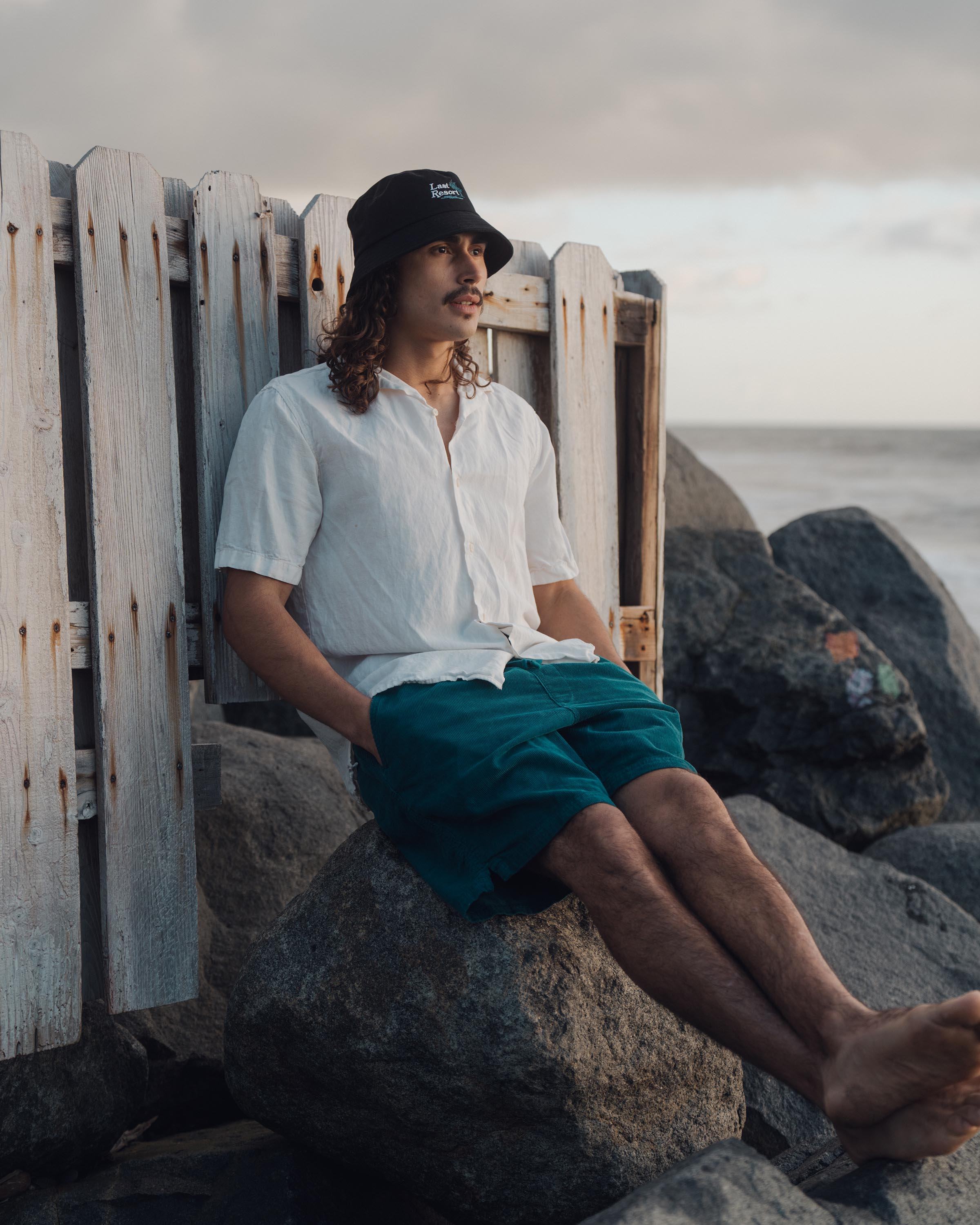 Hemlock male model looking right wearing Hemlock Last Resort Cotton Bucket Hat in Black