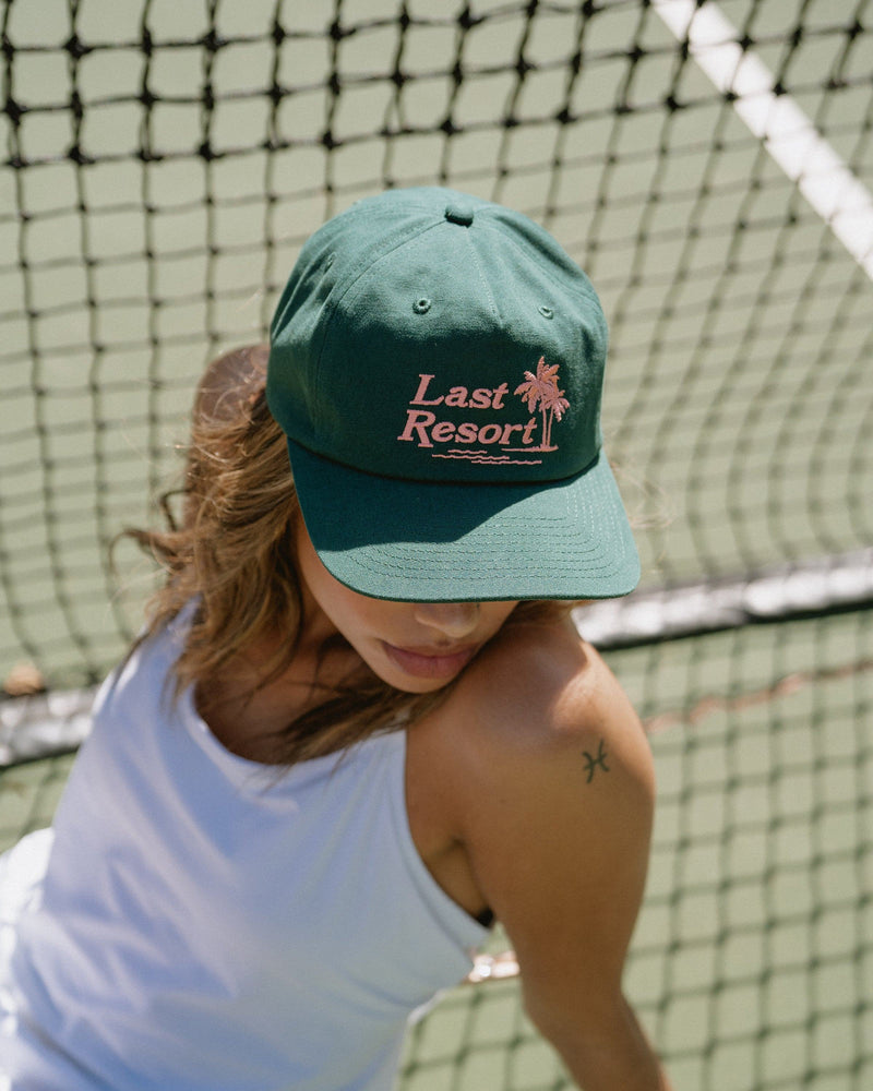 Hemlock female model wearing Hemlock Last Resort Baseball Hat in Clover top view