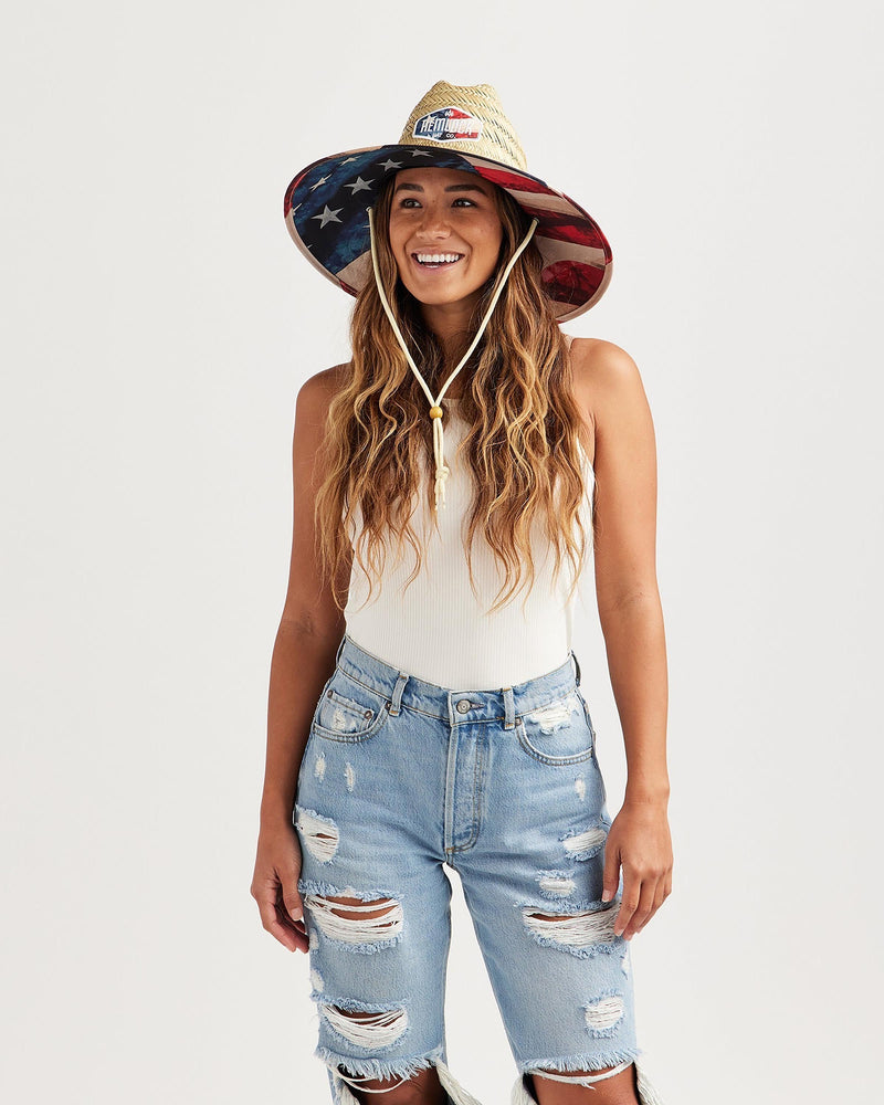 Hemlock female model looking left wearing Liberty straw lifeguard hat with USA flag pattern