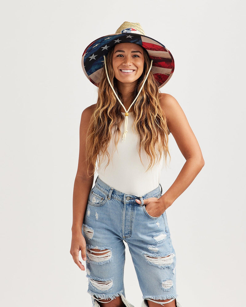 Hemlock female model looking straight wearing Liberty straw lifeguard hat with USA flag pattern