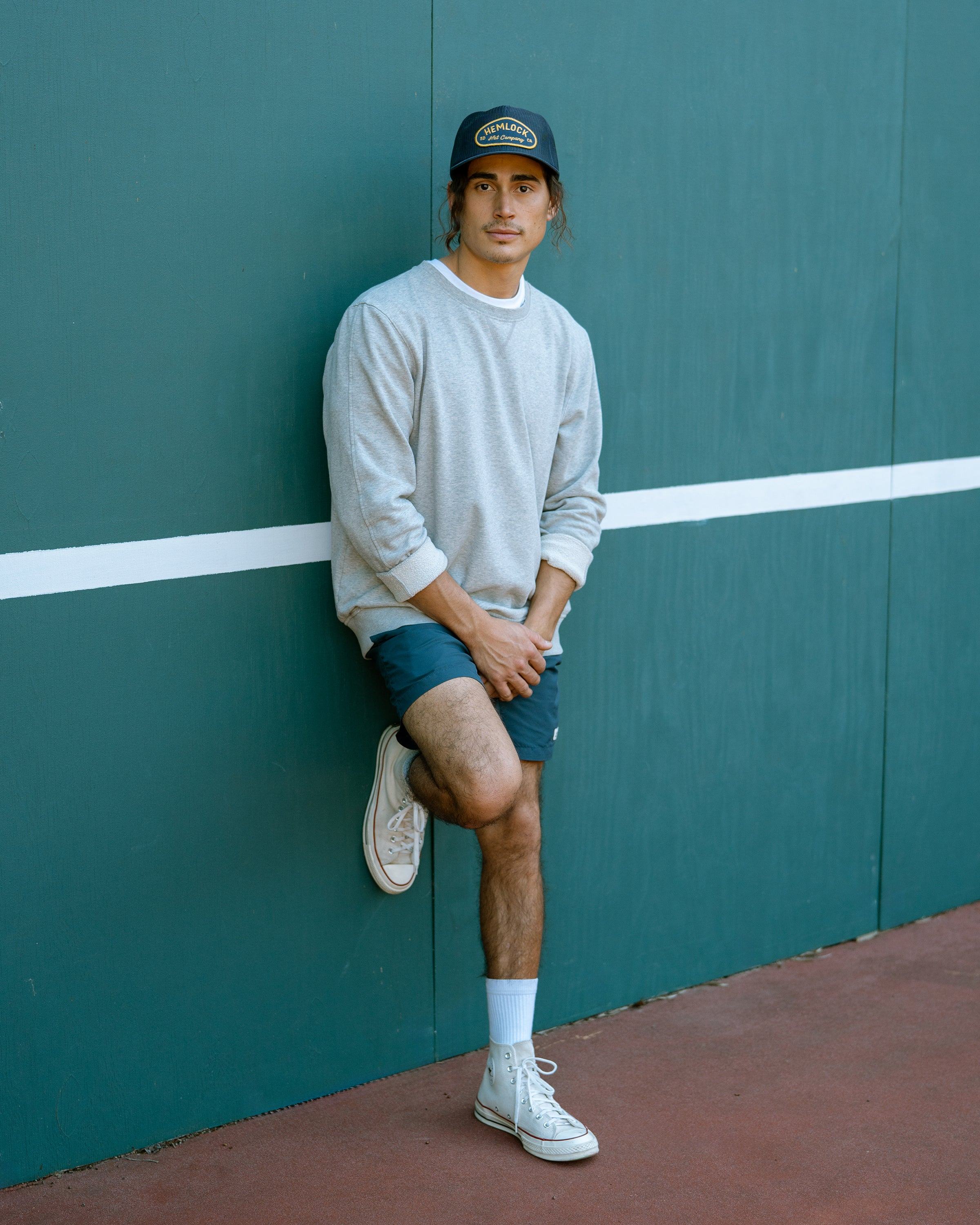 Hemlock male model looking straight wearing Mack Trucker Hat in Navy