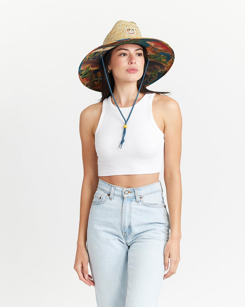 Hemlock female model looking right wearing Mariner straw lifeguard hat with saltwater fish pattern