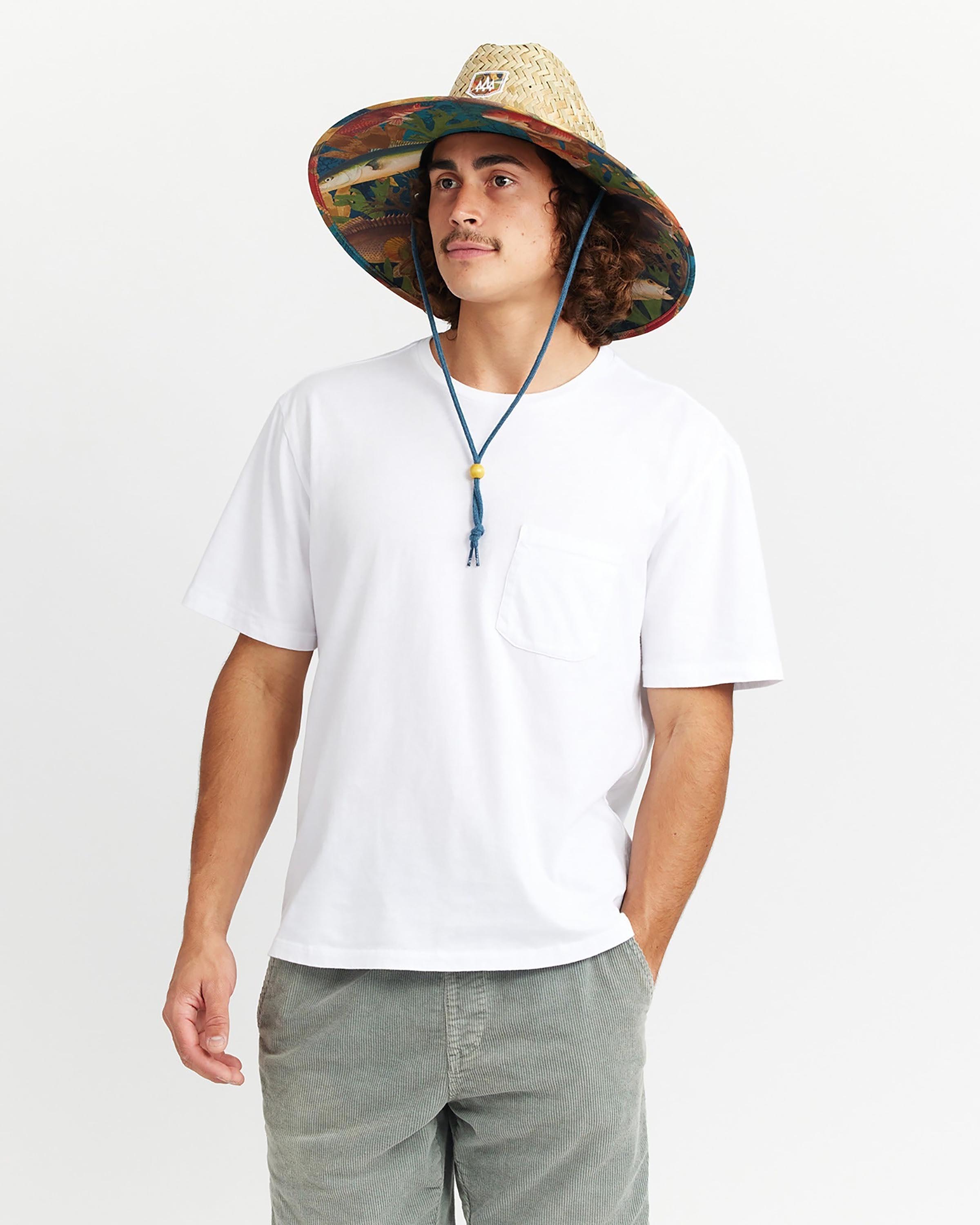 Hemlock male model looking left wearing Mariner straw lifeguard hat with saltwater fish pattern