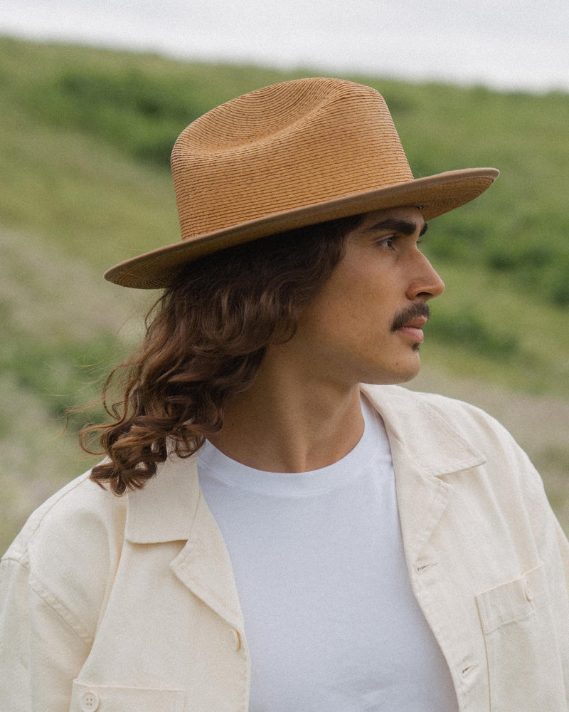 Hemlock male model side profile looking right wearing Hemlock Mateo Straw Rancher Hat in Saddle