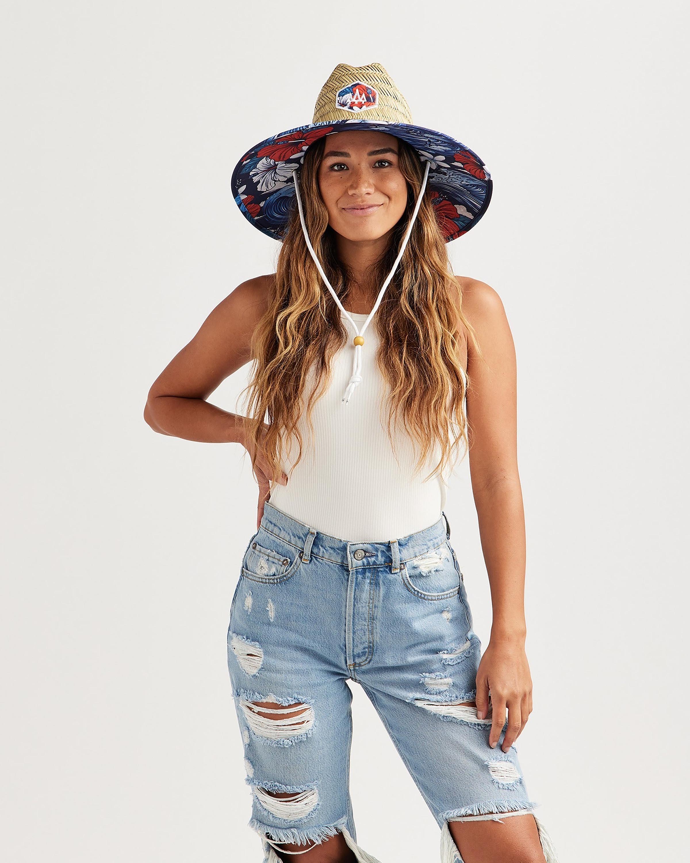 Hemlock female model looking straight wearing Midway straw lifeguard hat with USA floral pattern