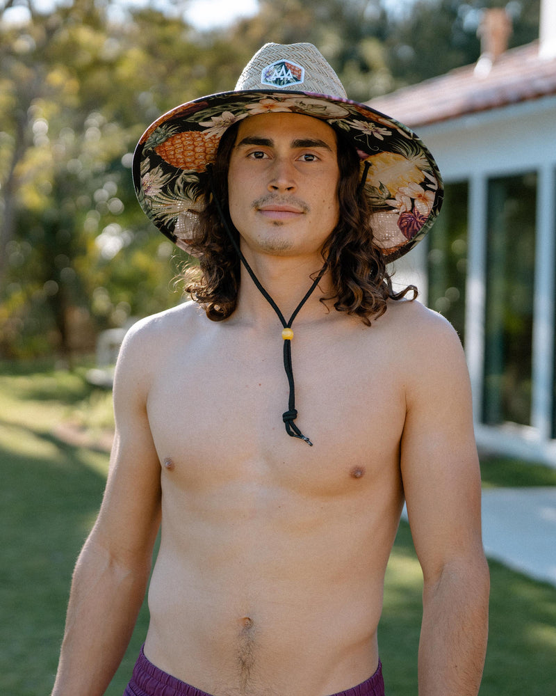 Hemlock male model looking straight wearing Nightcap straw lifeguard hat with pineapple pattern