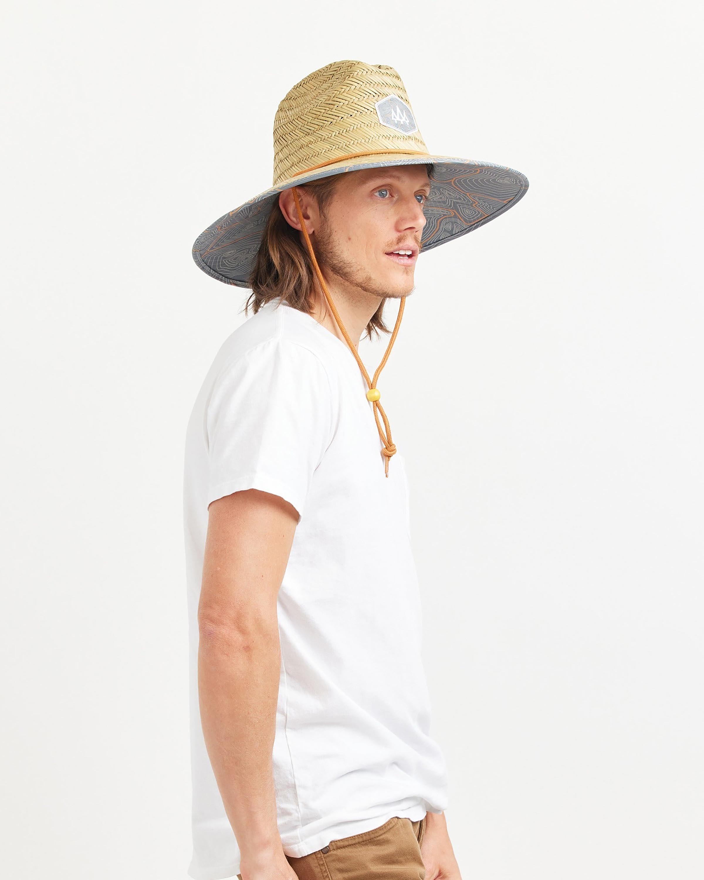 Hemlock male model looking right wearing Nomad straw lifeguard hat with topography pattern
