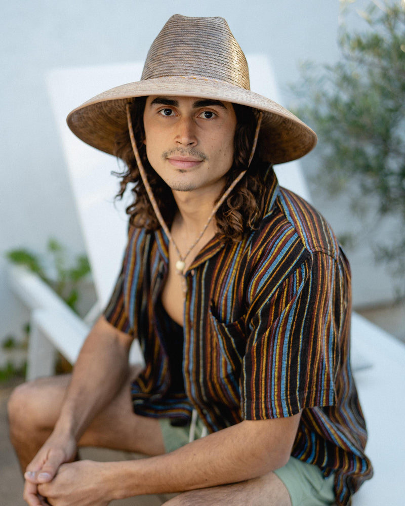 Hemlock male model looking straight wearing Santos Straw Lifeguard Hat in Toast