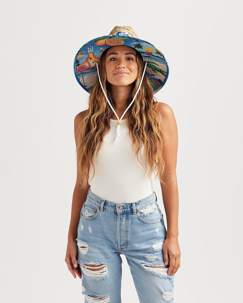 Hemlock female model looking straight wearing Seaside straw lifeguard hat with beachside pattern