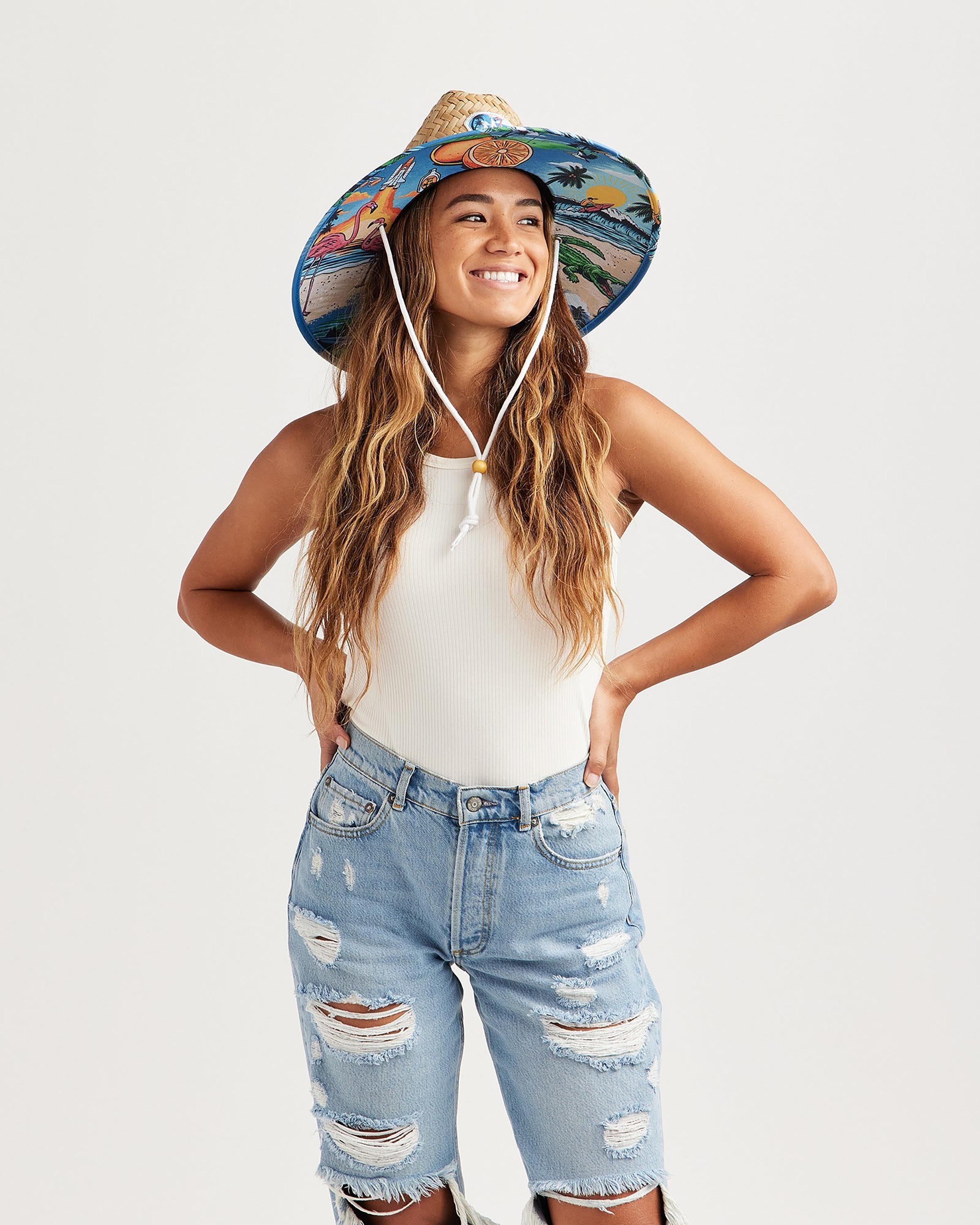 Hemlock female model looking right wearing Seaside straw lifeguard hat with beachside pattern