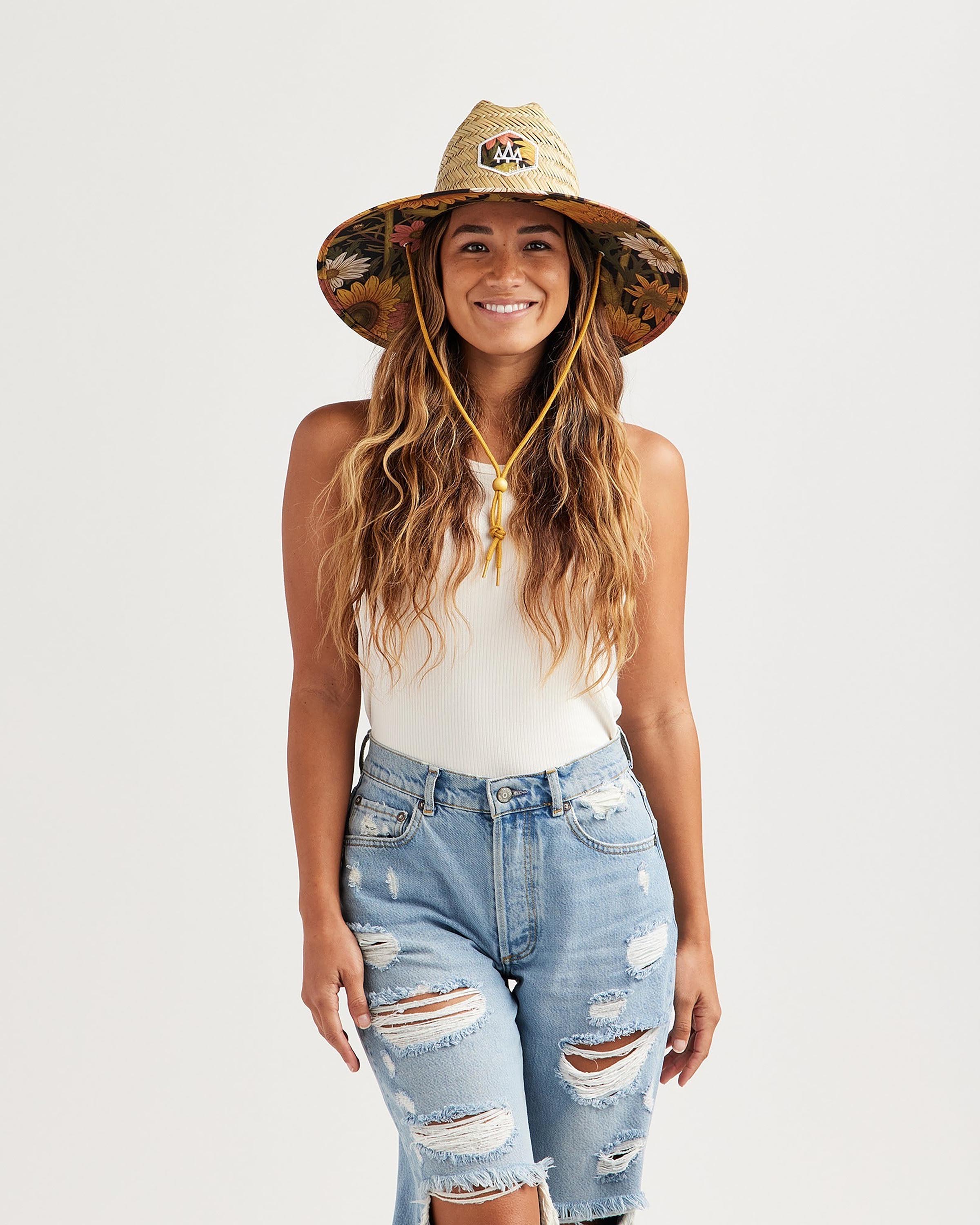 Hemlock female model looking straight wearing Woodstock straw lifeguard hat with sunflower pattern