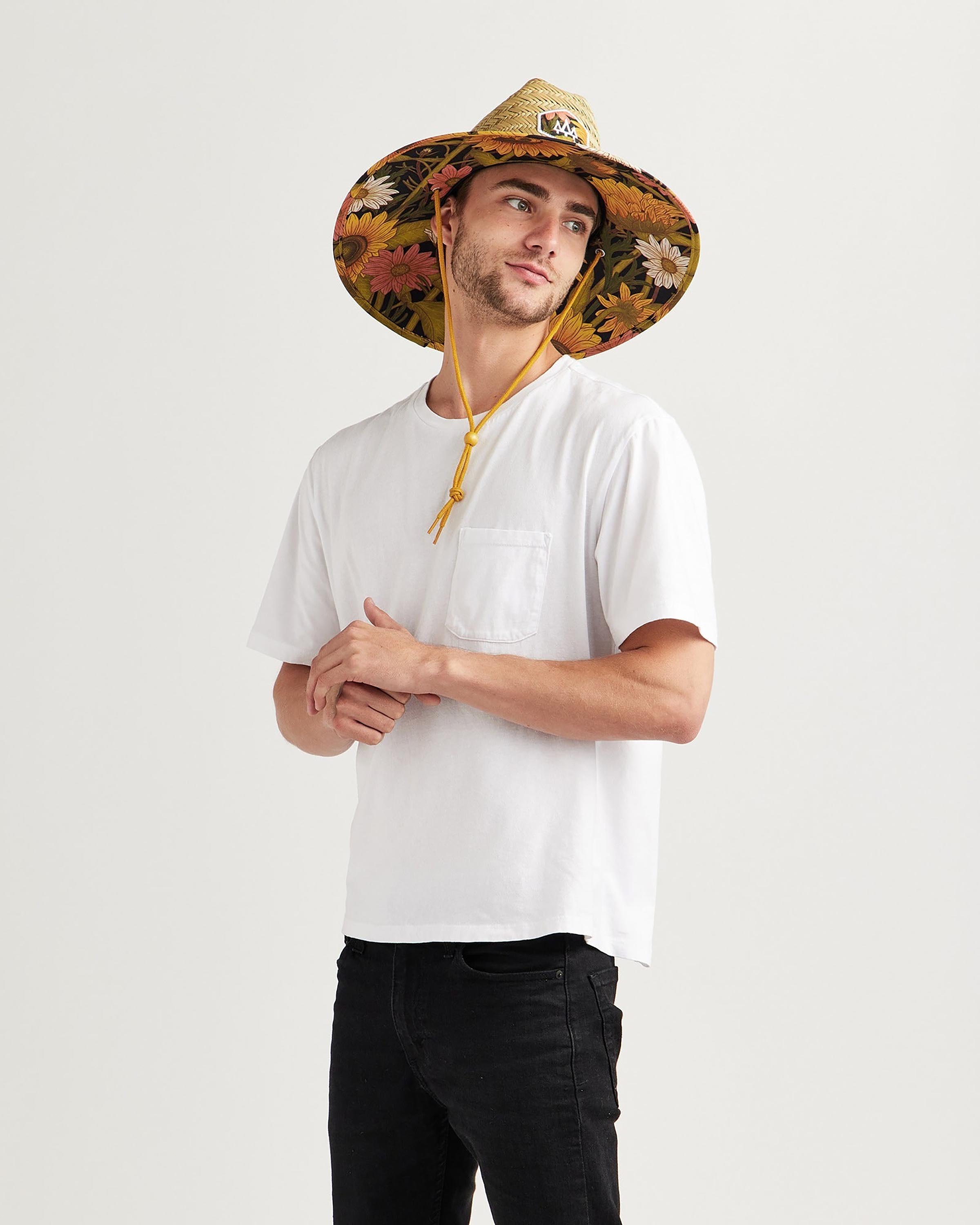 Hemlock male model looking right wearing Woodstock straw lifeguard hat with sunflower pattern